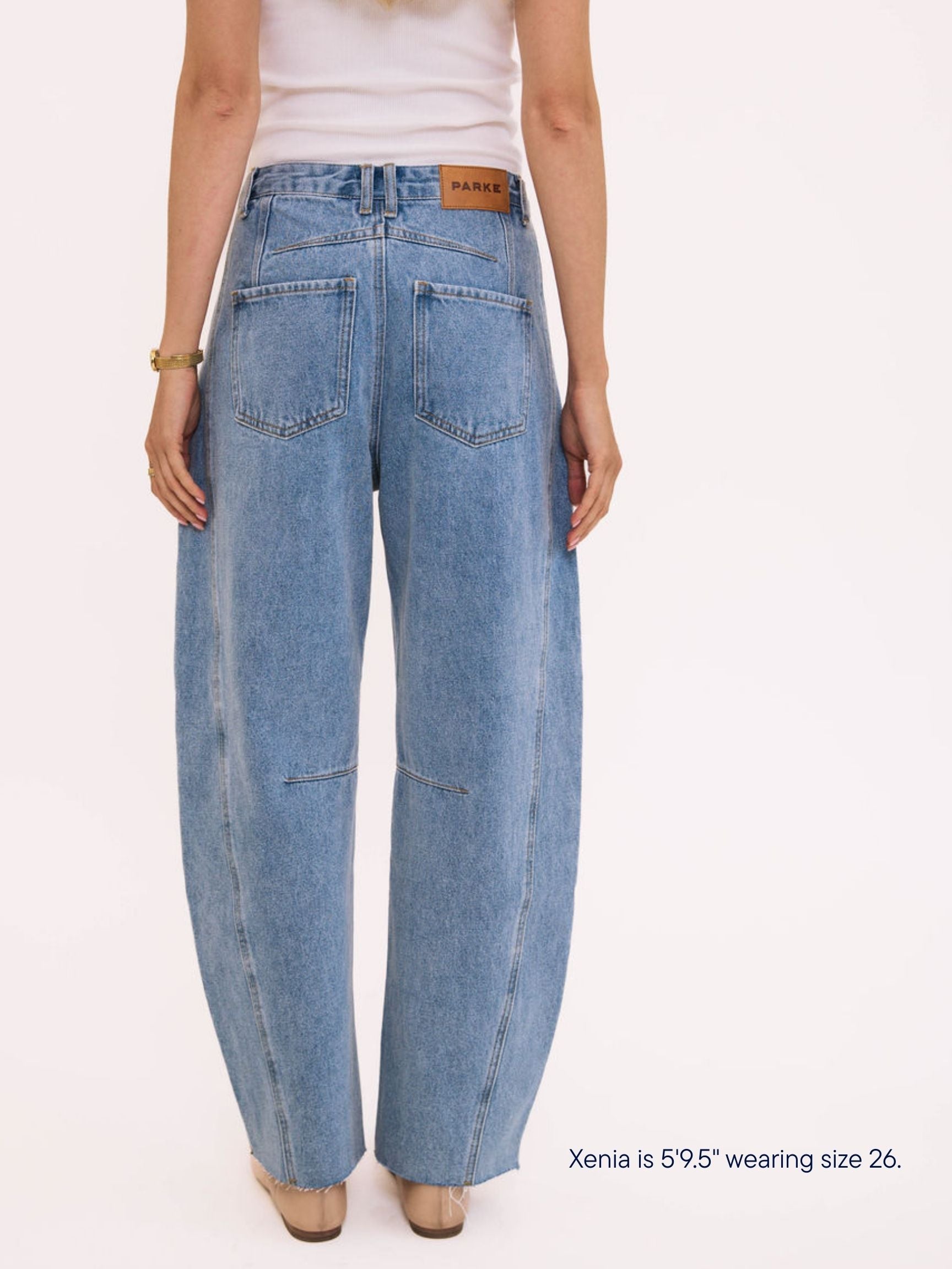 girl wearing parke x scl oversized horseshoe jean -vintage wash
