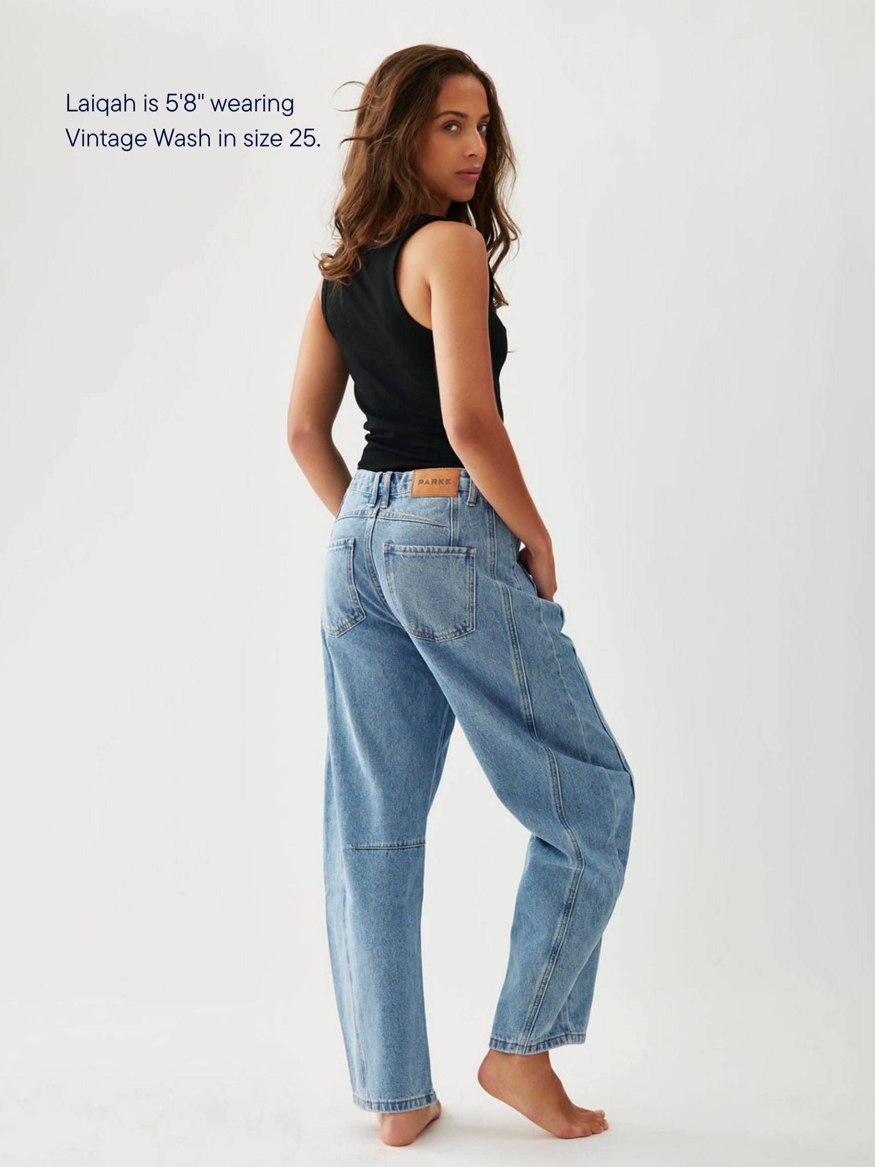 girl wearing horseshoe jeans -vintage wash