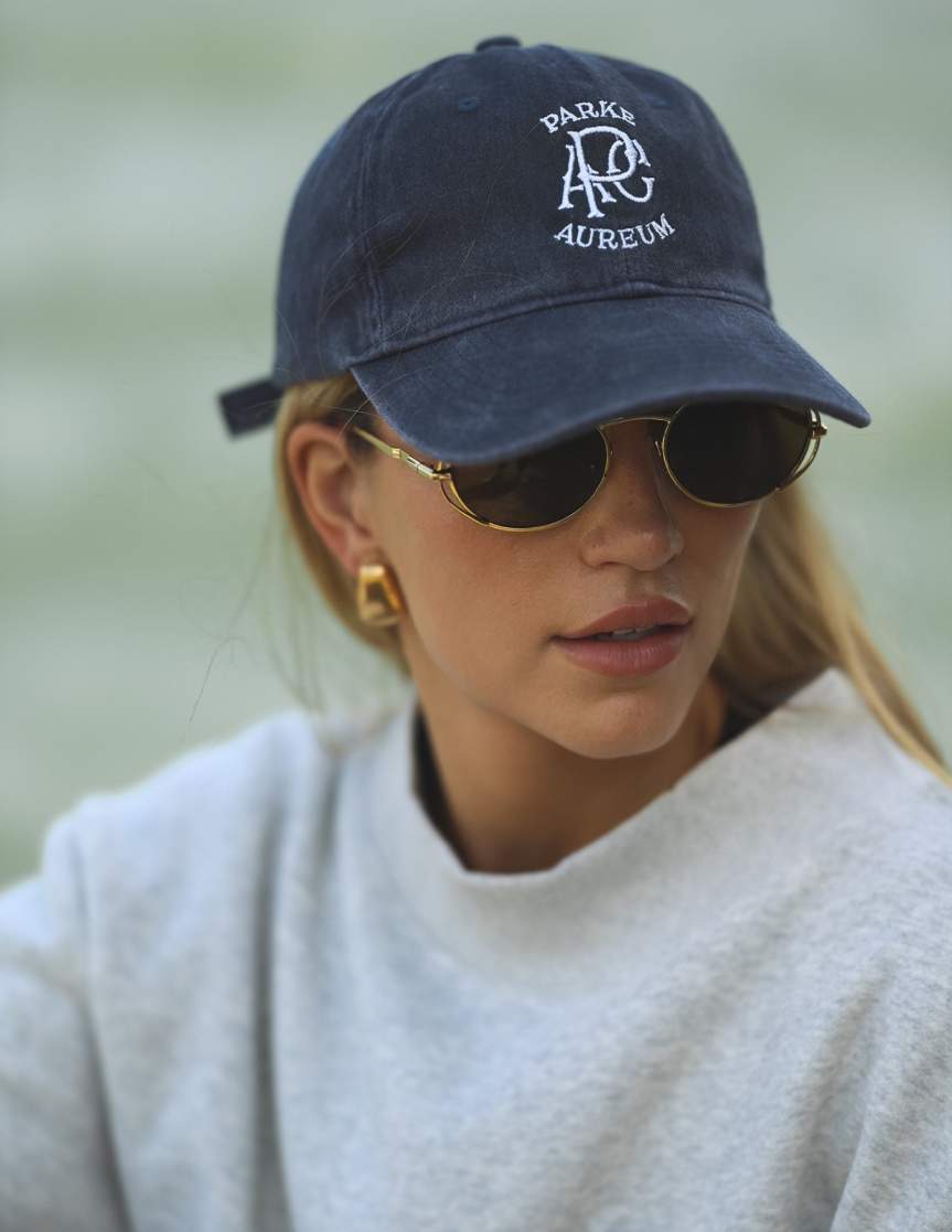 girl wearing parke x aureum hat -navy