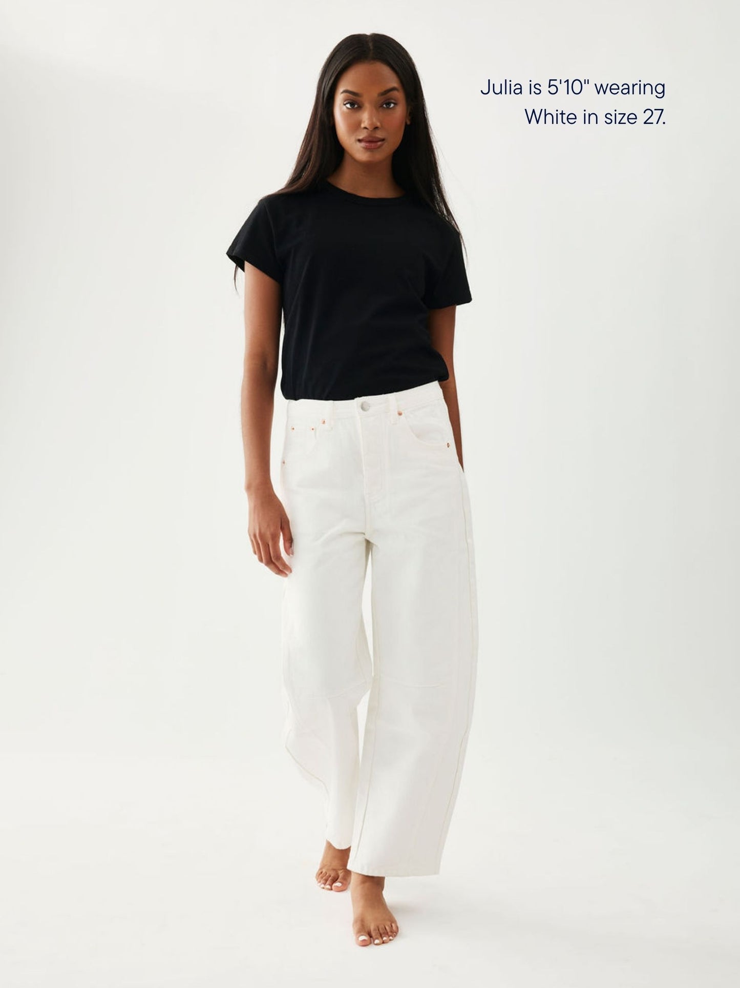 girl wearing horseshoe jeans -white