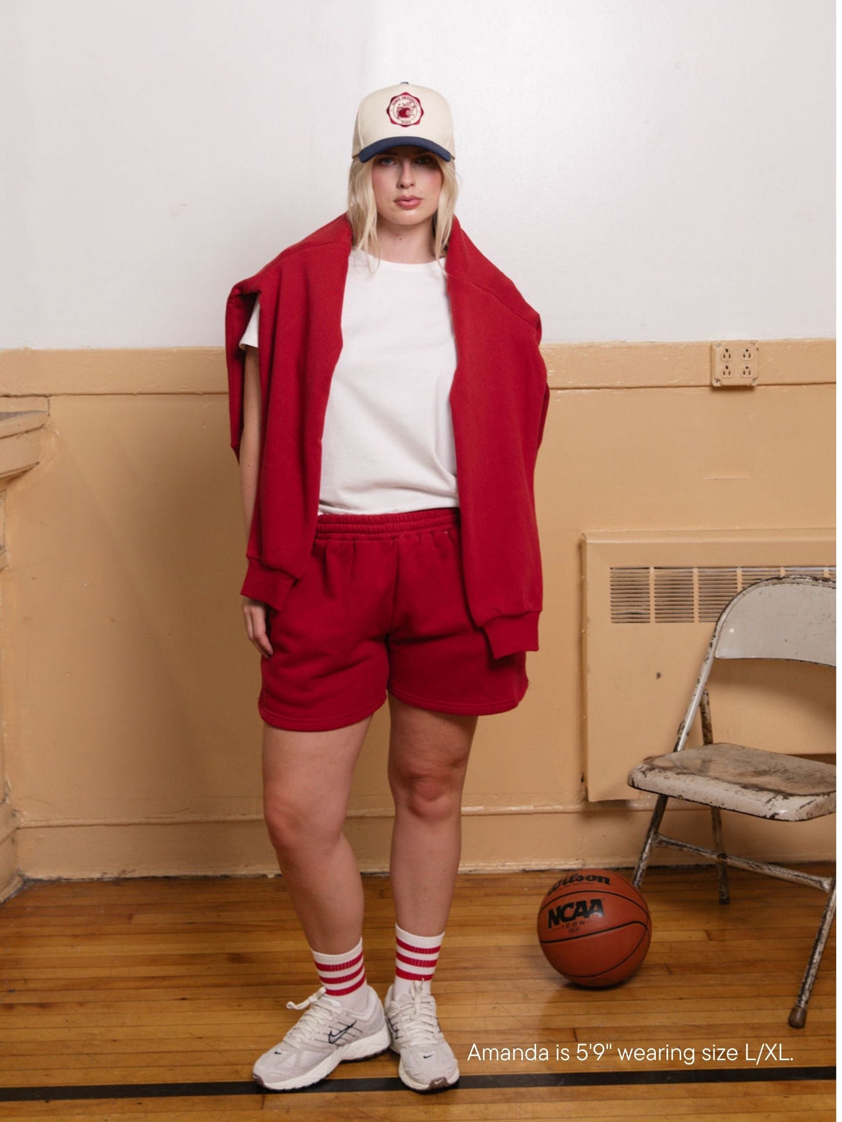 girl wearing lounge sweatshorts -crimson