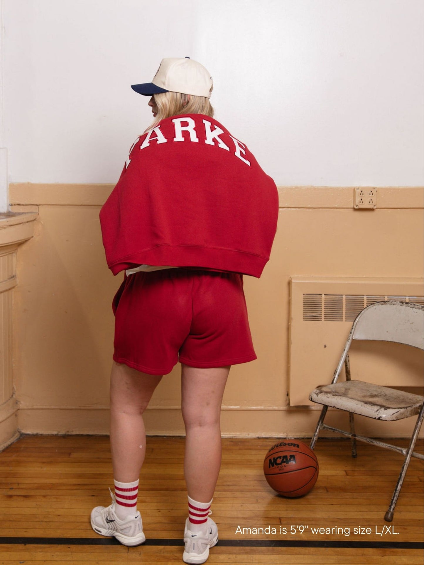 girl wearing lounge sweatshorts -crimson