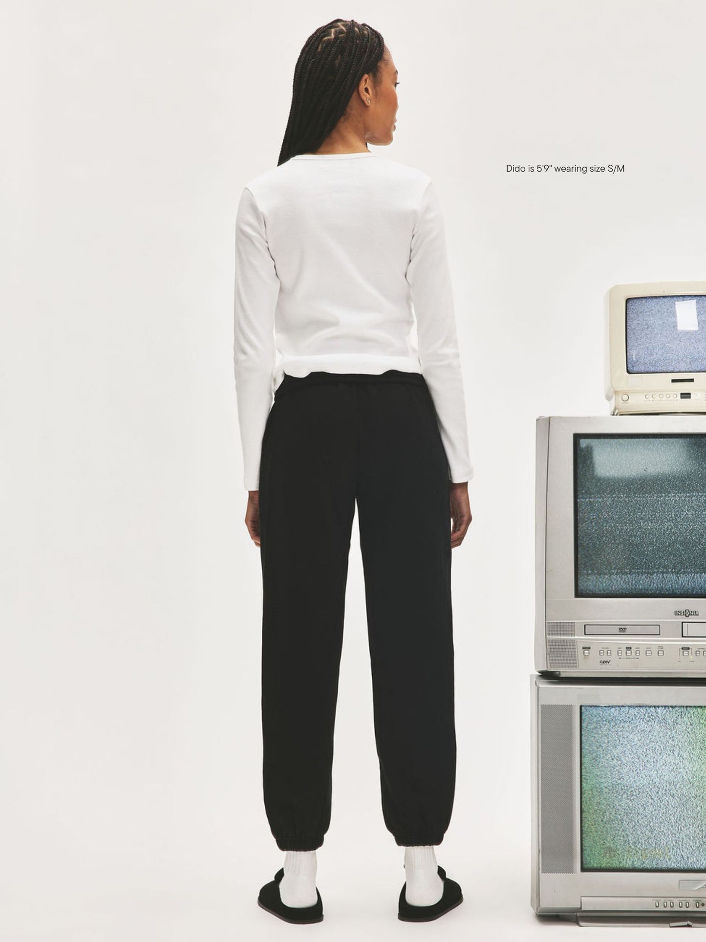 girl wearing Nostalgia Unisex Sweats -black