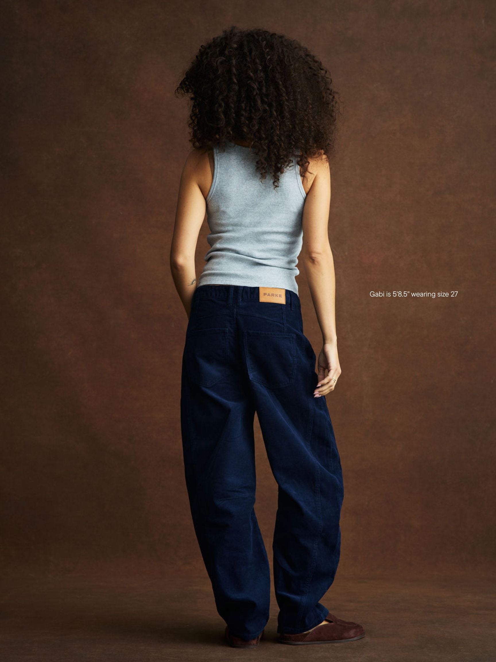 girl wearing Horseshoe Pants -navy corduroy