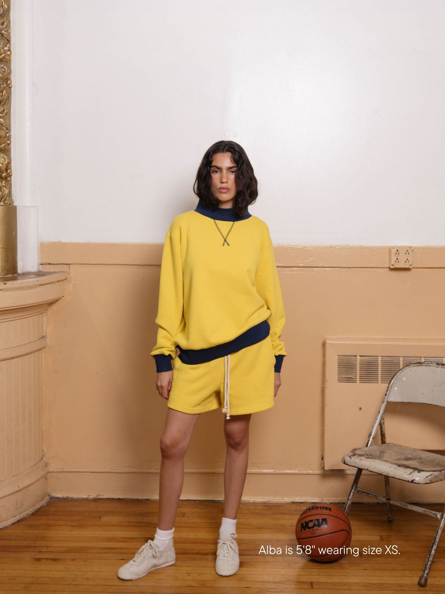girl wearing lounge sweatshorts -maize