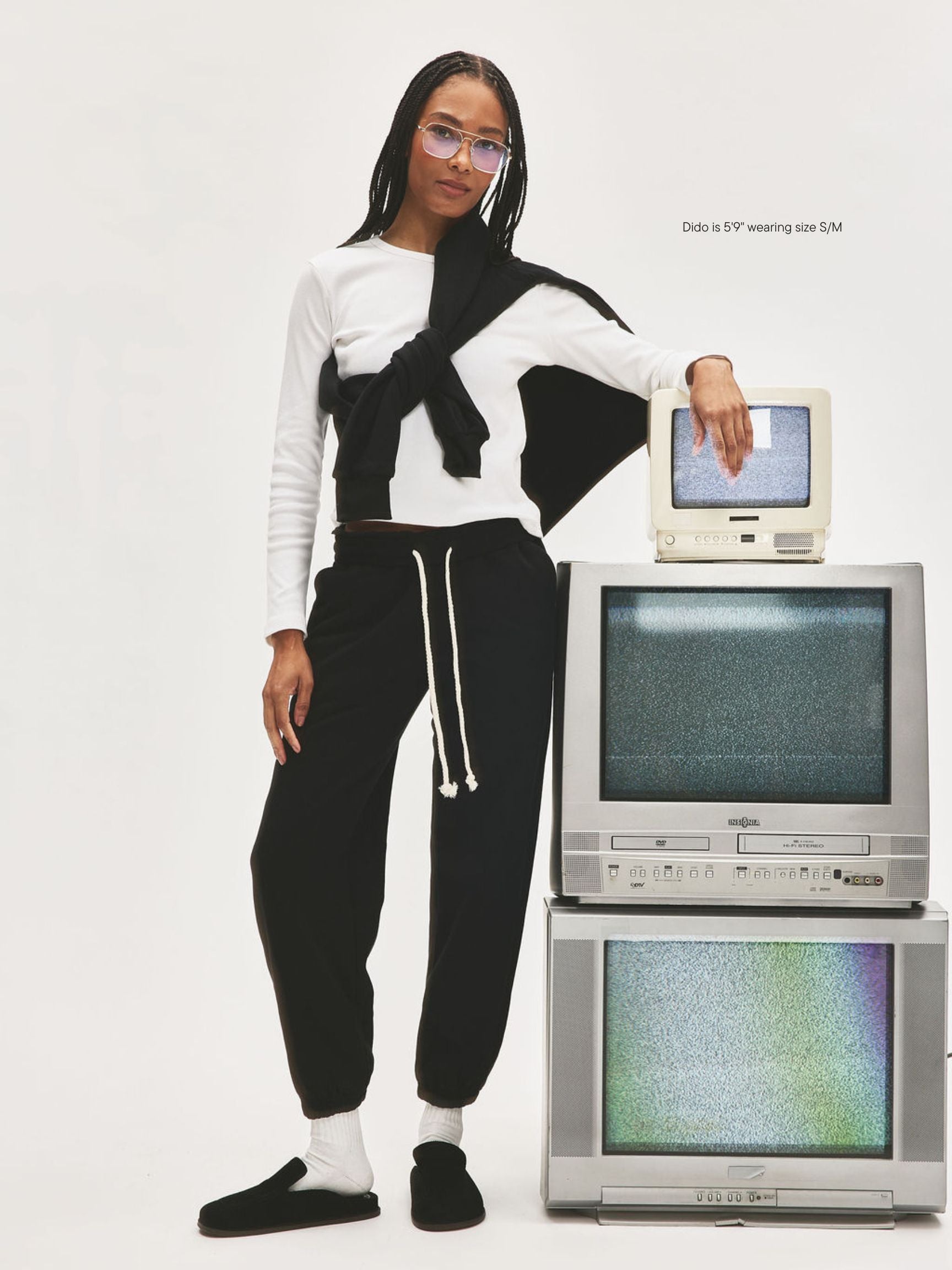 girl wearing Nostalgia Unisex Sweats -black