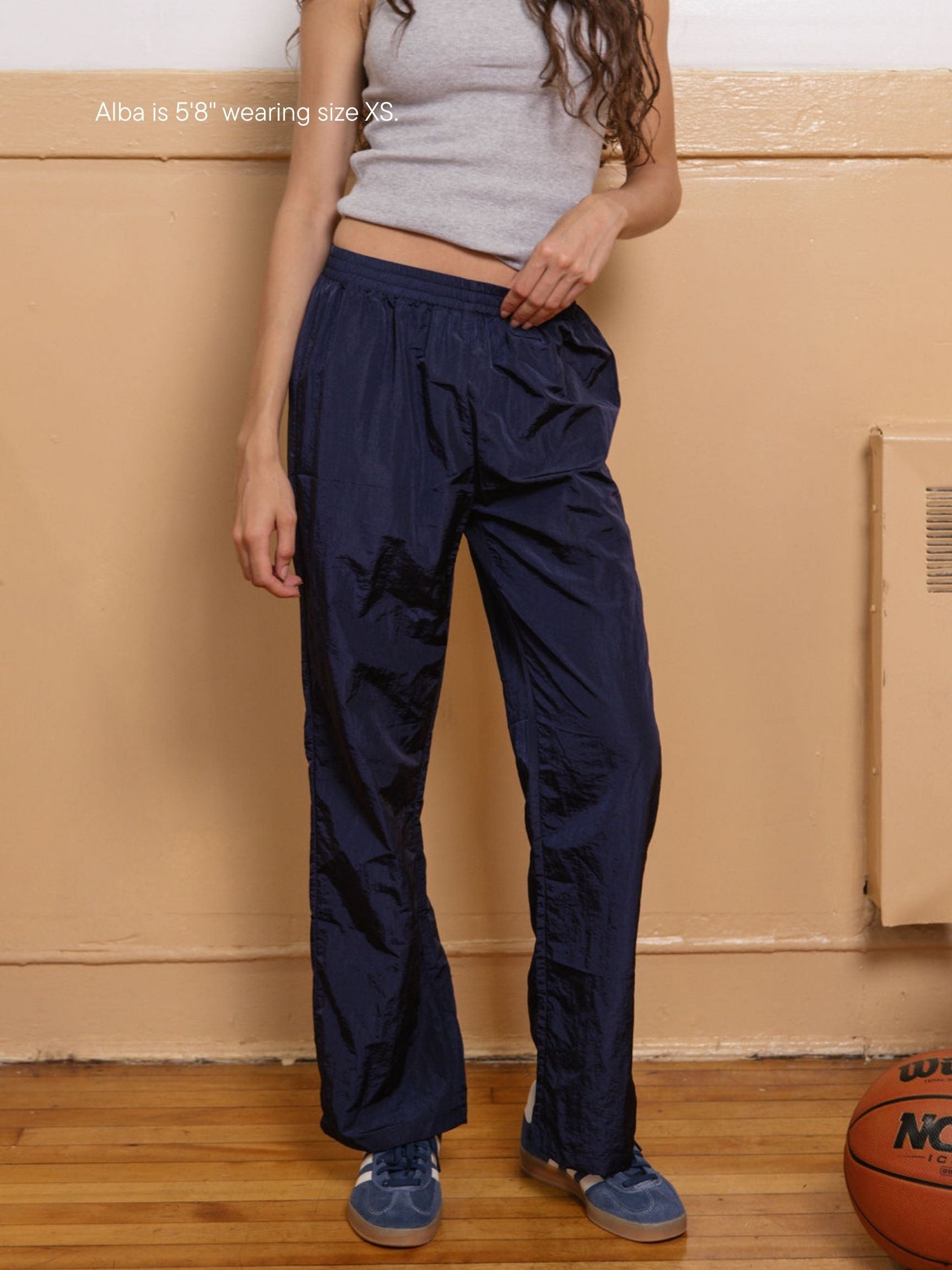 girl wearing nylon pants -navy