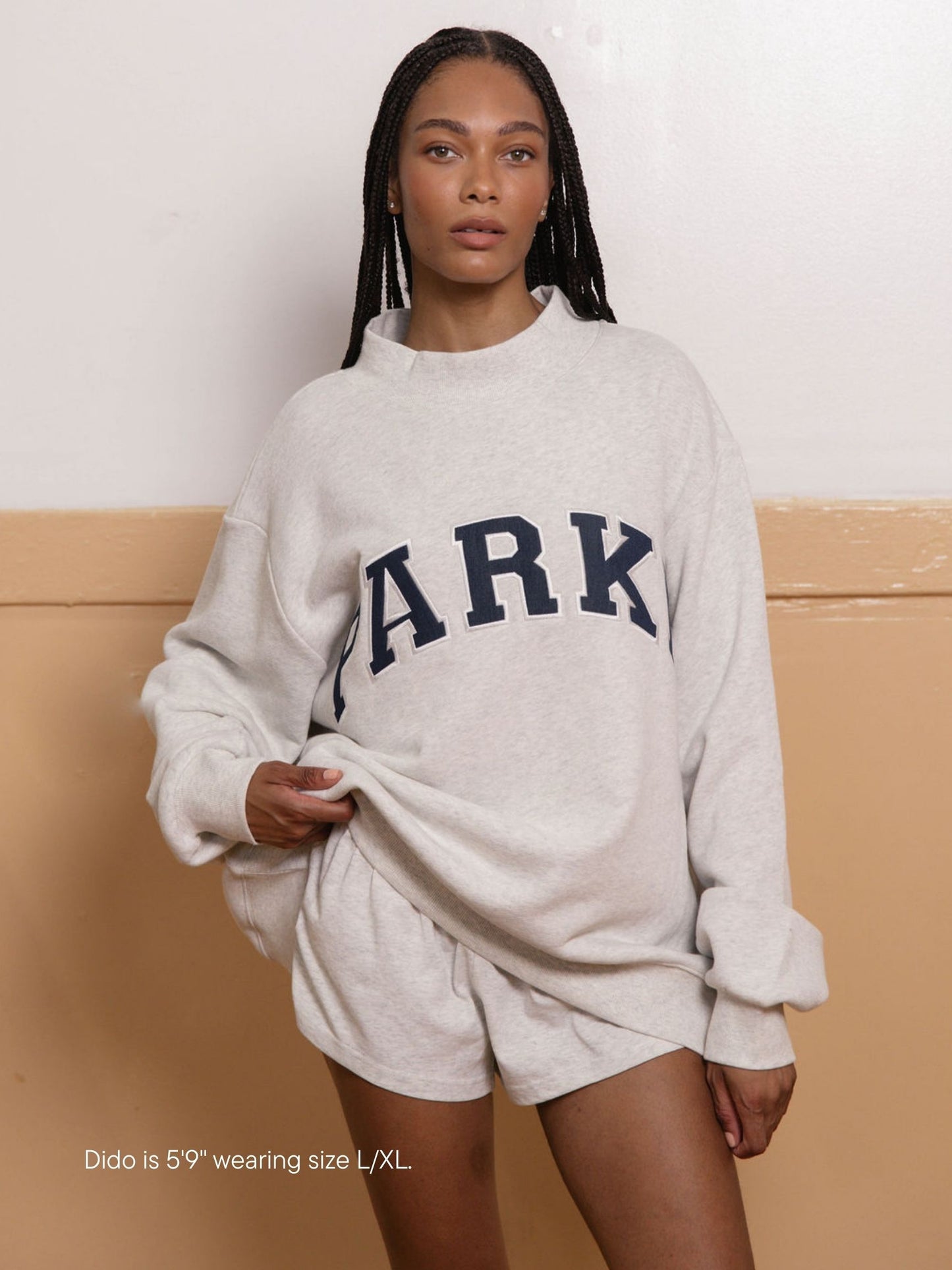 girl wearing back to school varsity mockneck -heather grey + white