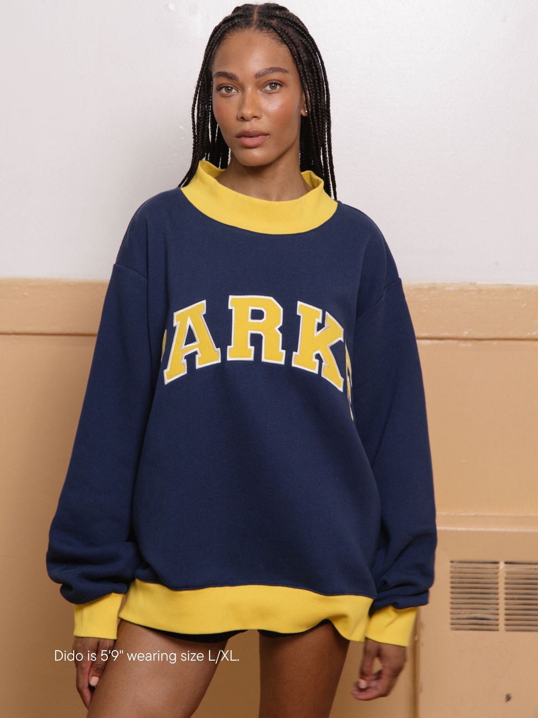 girl wearing two tone varsity mockneck -denim + maize