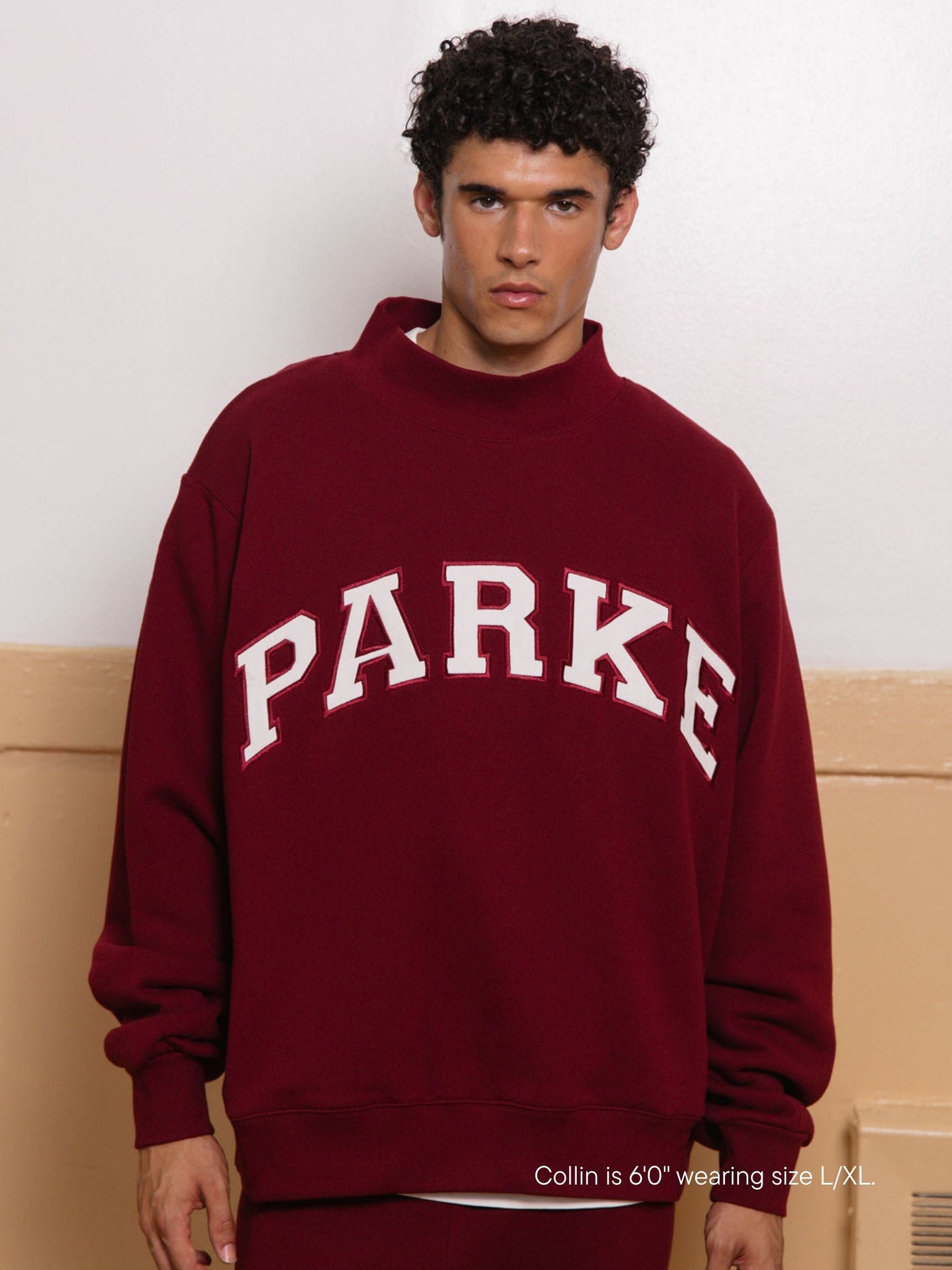 boy wearing back to school varsity mockneck -maroon + white