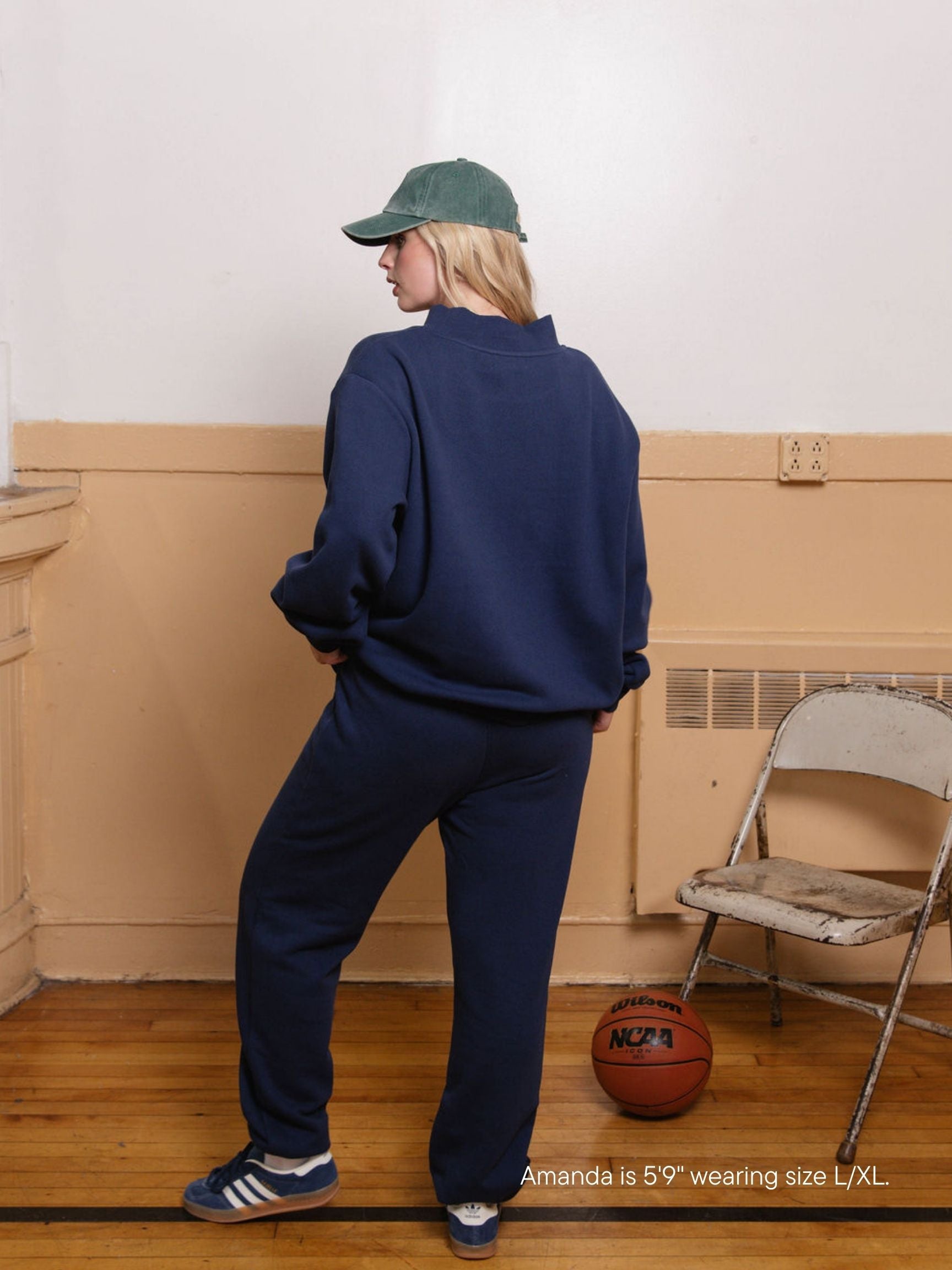 girl wearing back to school varsity mockneck -denim + white