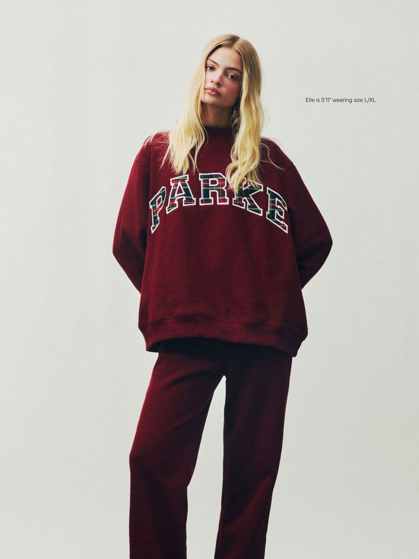 girl wearing Holiday Plaid Varsity Mockneck -maroon + plaid