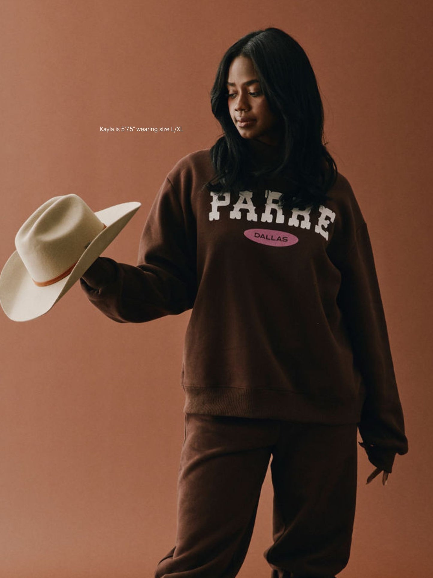 girl wearing Cities Signature Mockneck -cowboy dallas