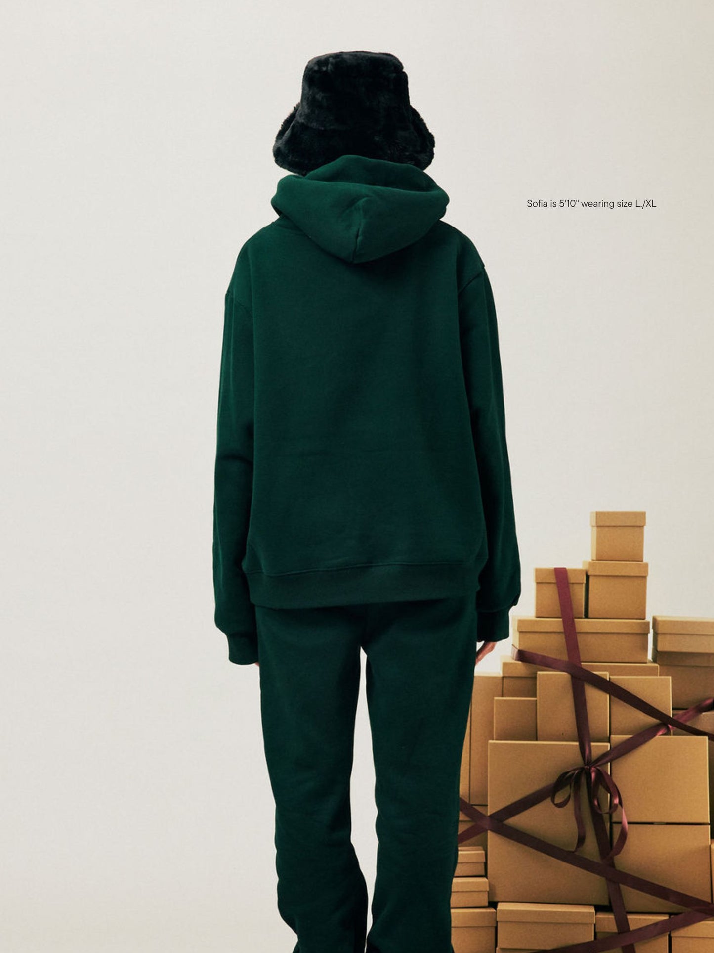 girl wearing Holiday Varsity Hoodie -forest + maroon