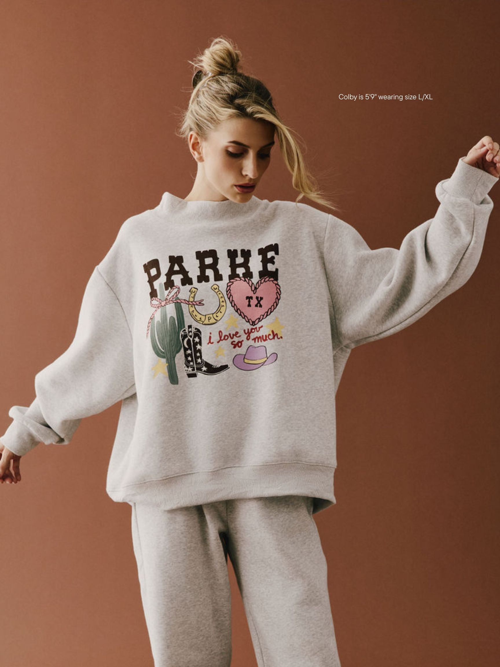 girl wearing Cities Graphic Mockneck -texas