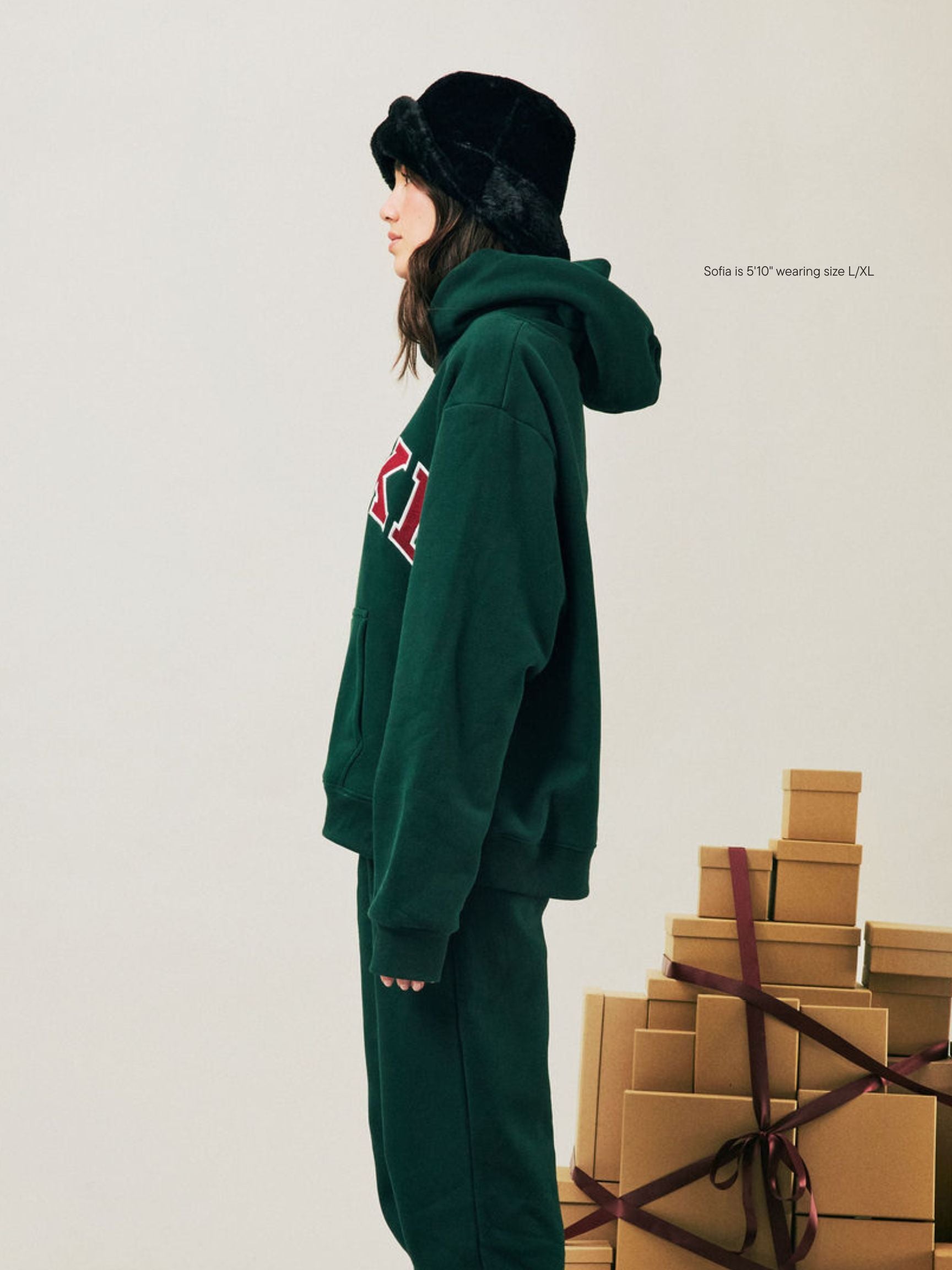 girl wearing Holiday Varsity Hoodie -forest + maroon