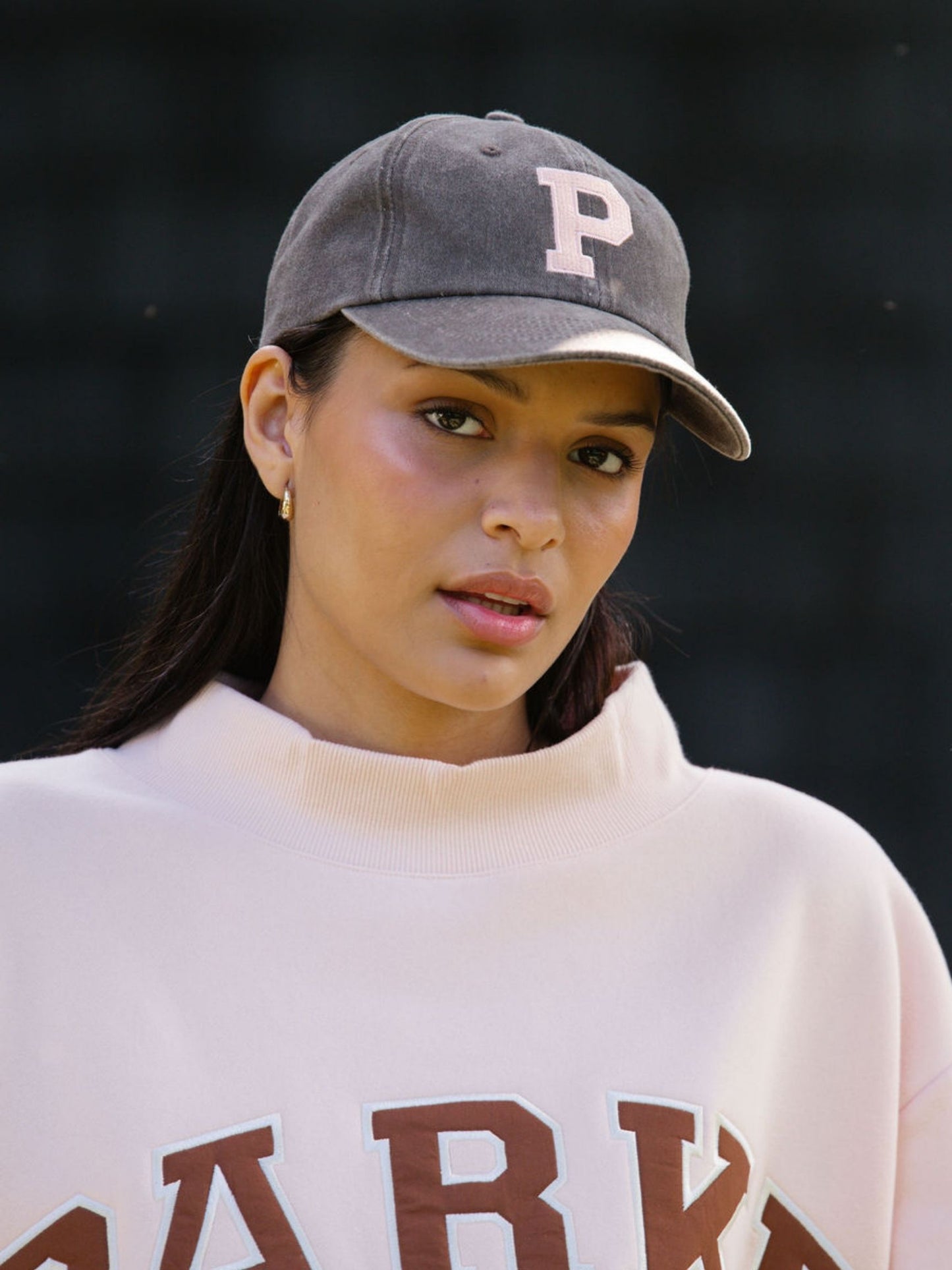 girl wearing P hat -mocha
