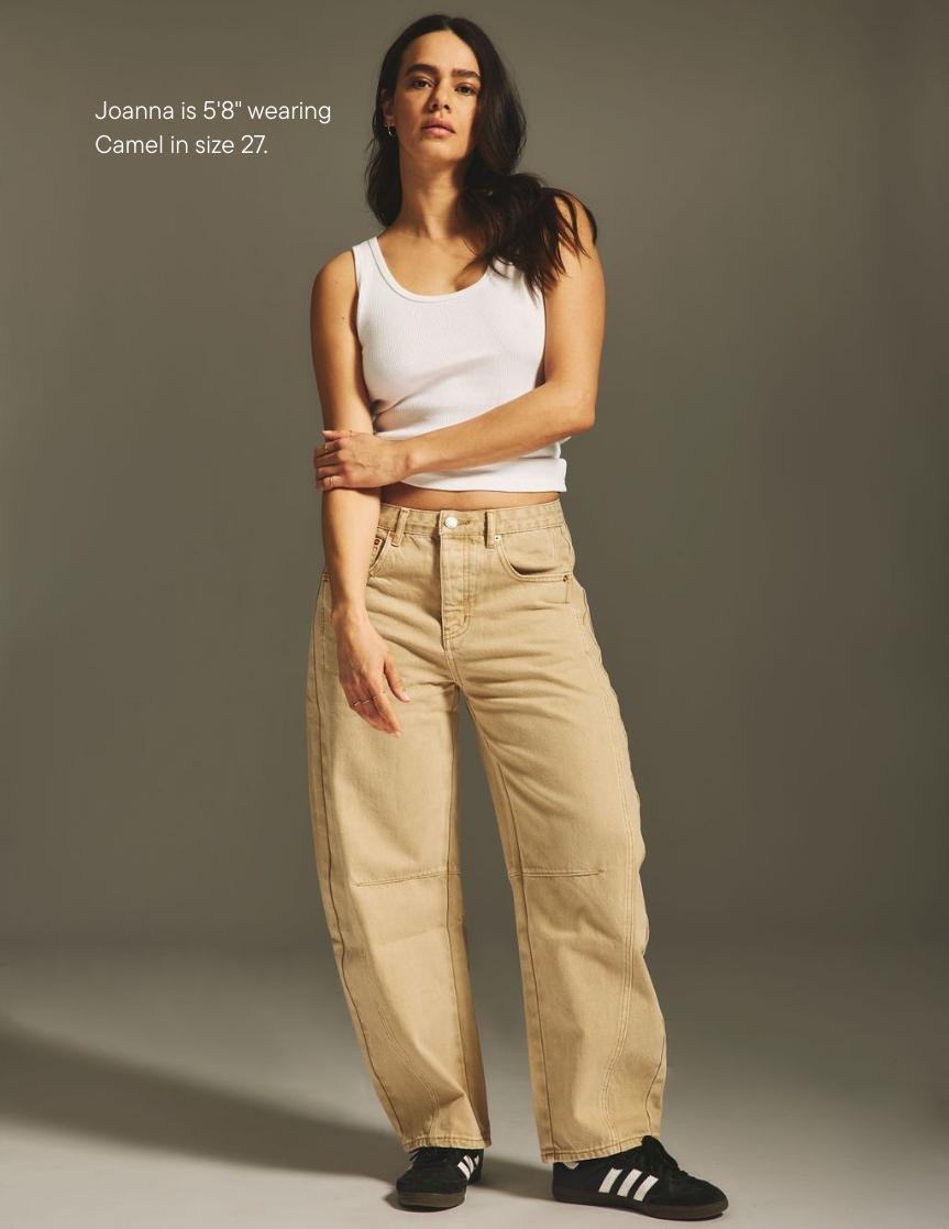girl wearing horseshoe jean -camel