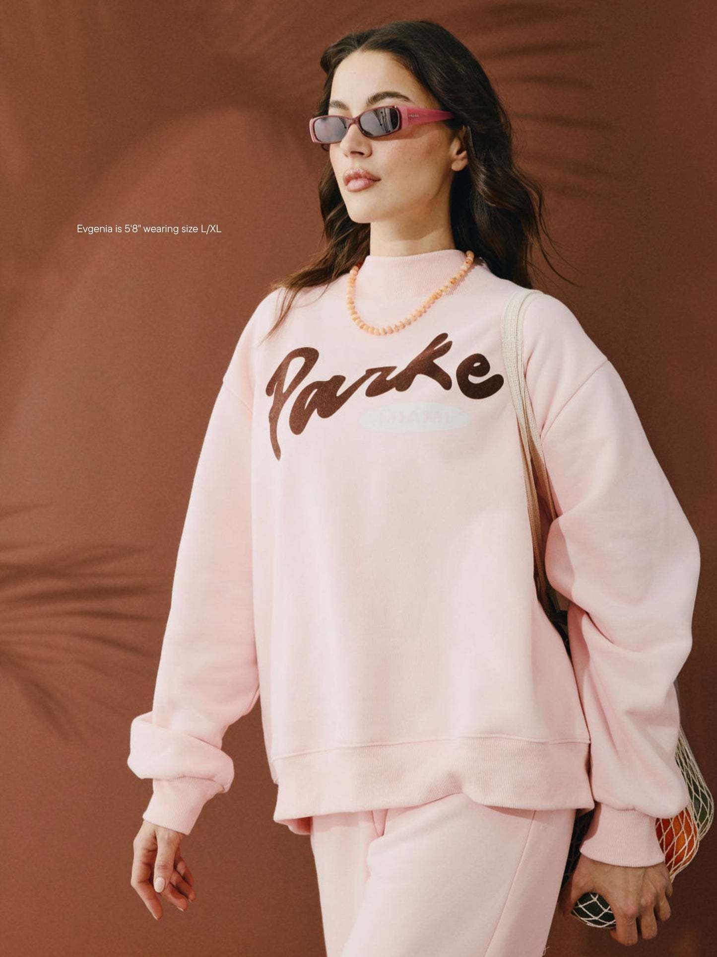 girl wearing Cities Signature Mockneck -taffy