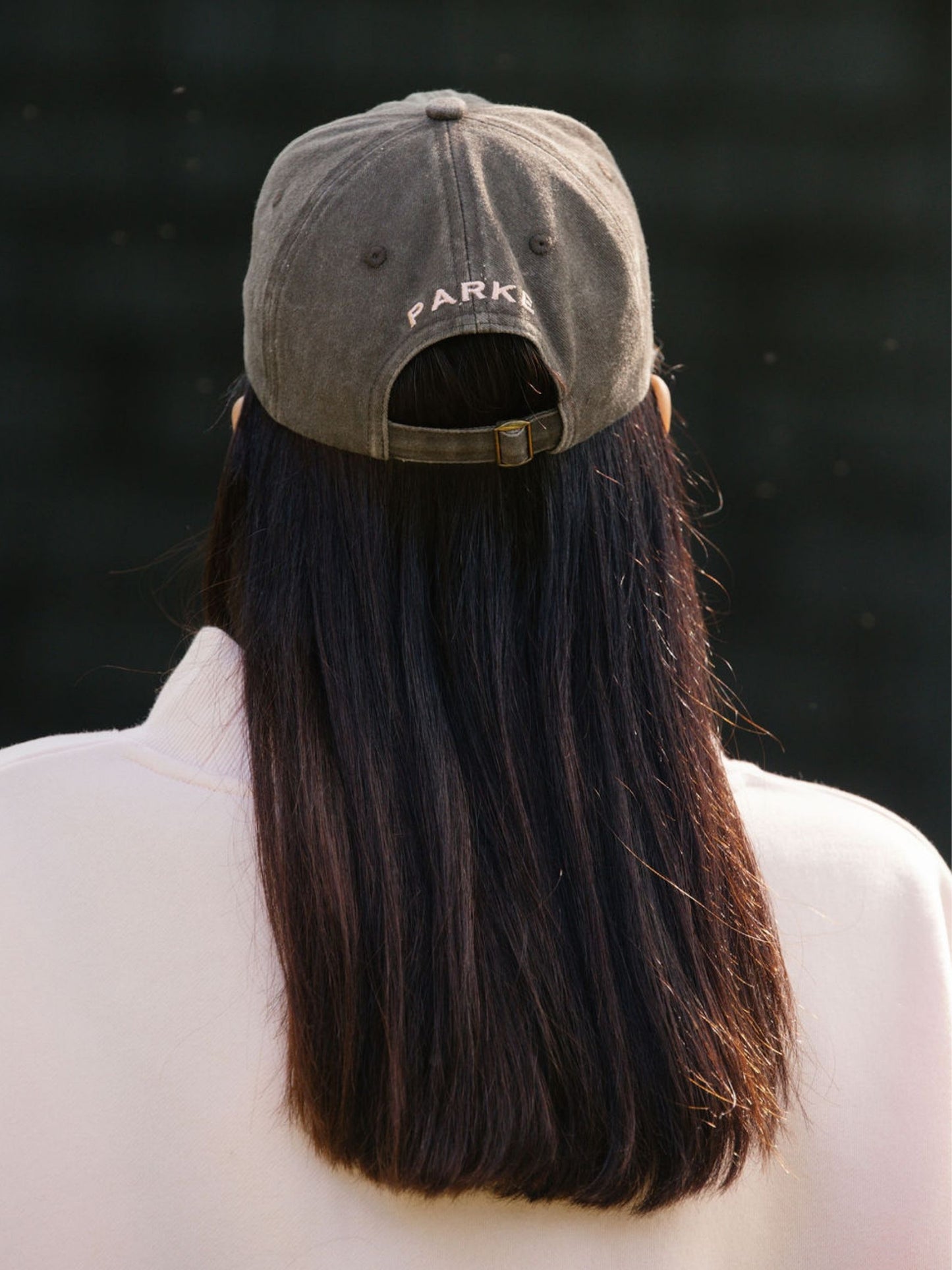 girl wearing P hat -mocha