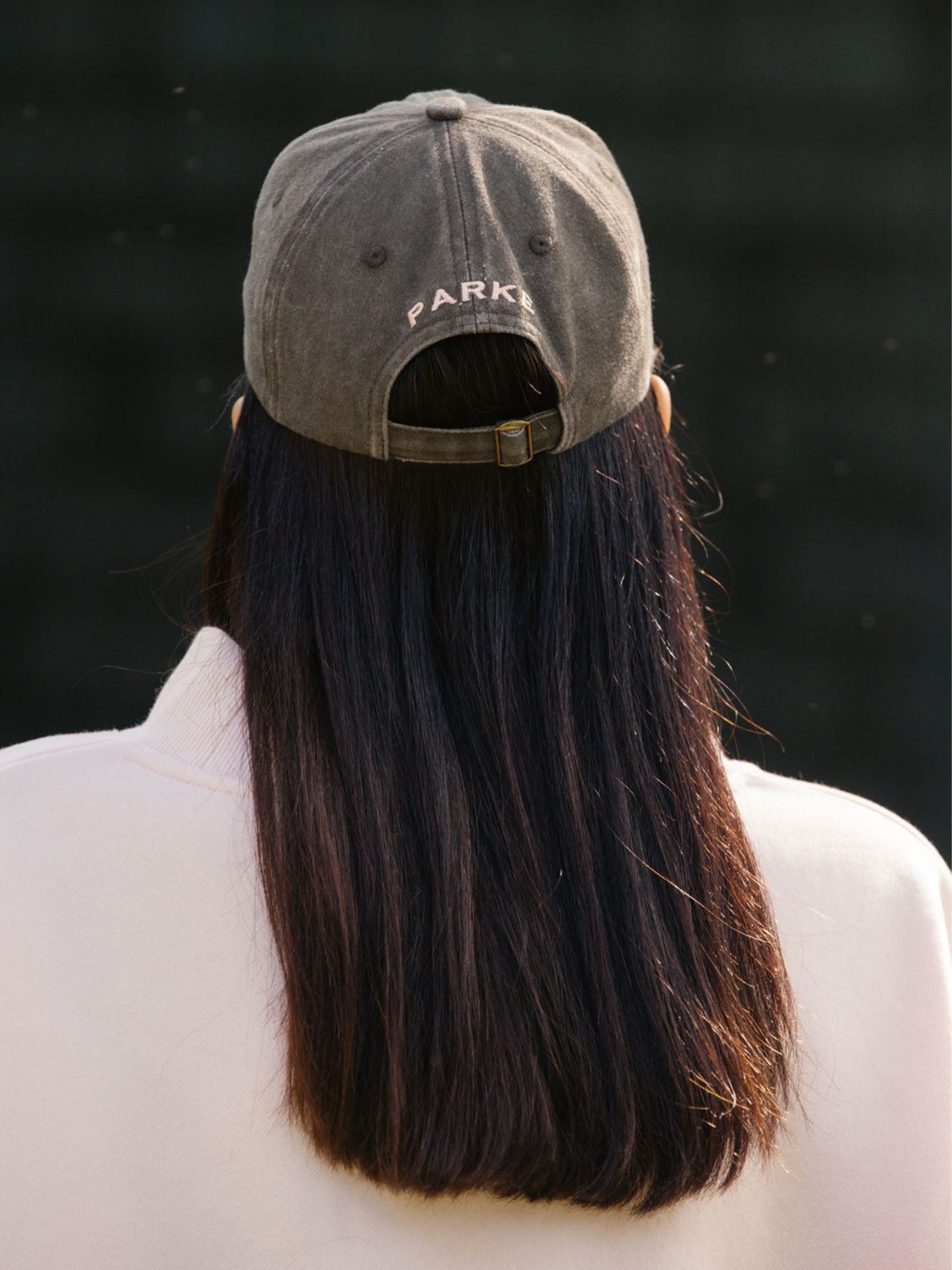 girl wearing P hat -mocha