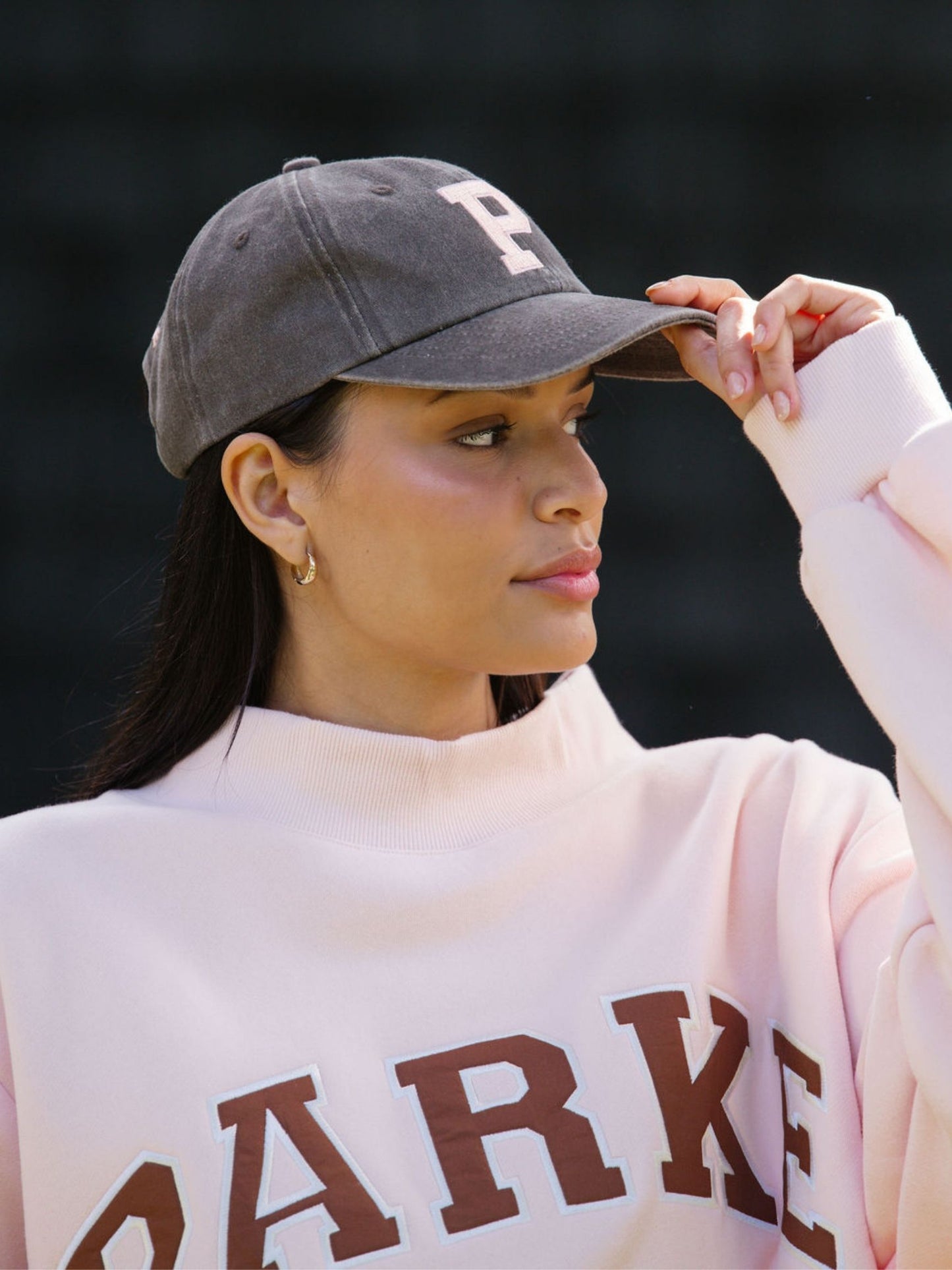 girl wearing P hat -mocha