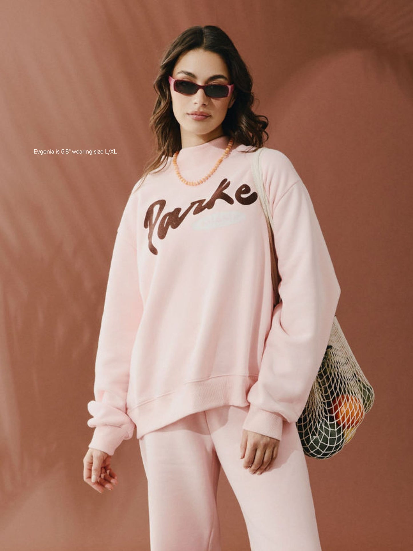 girl wearing Cities Signature Mockneck -taffy