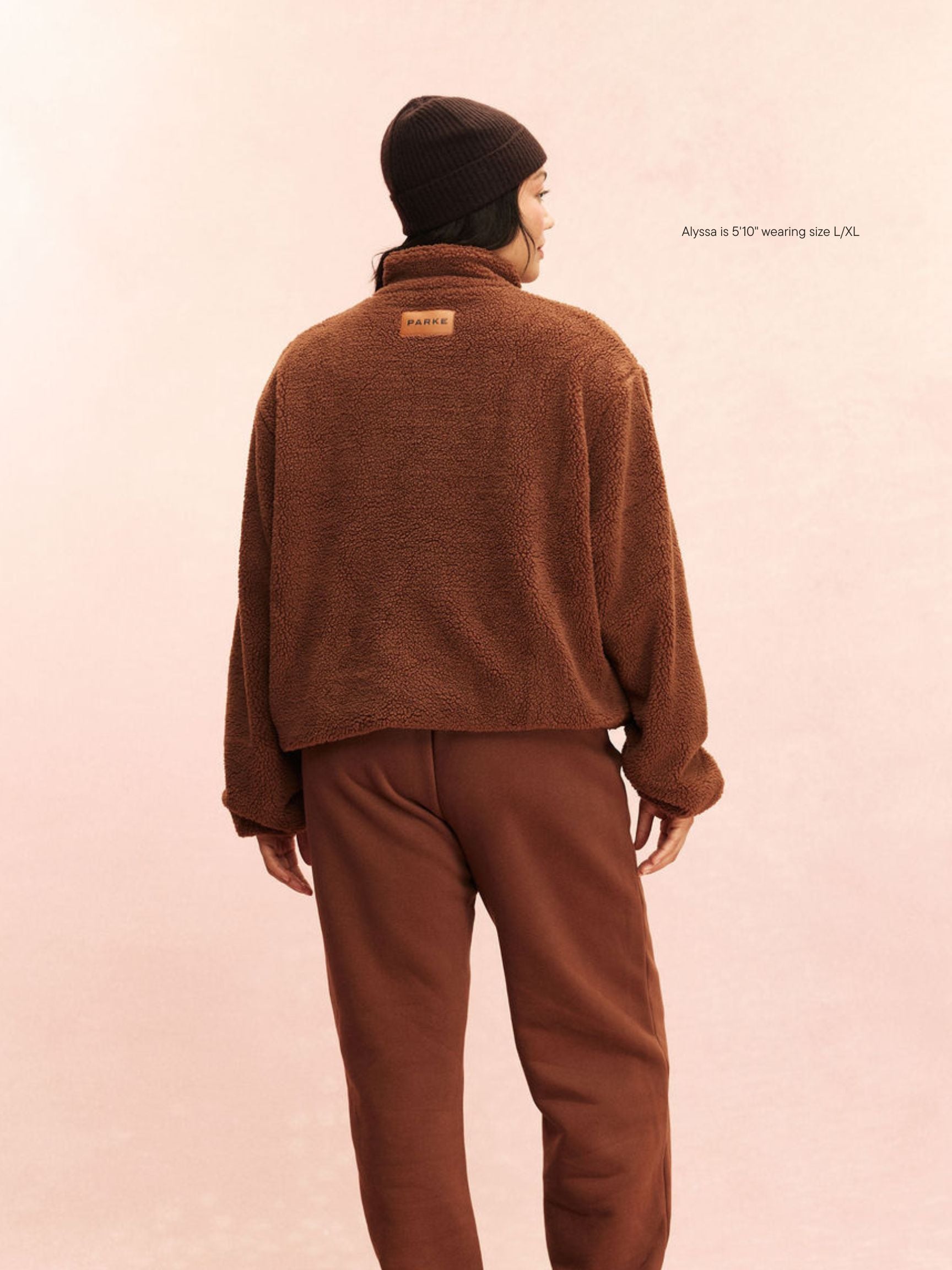 girl wearing Quarter Zip Fleece Pullover -mocha