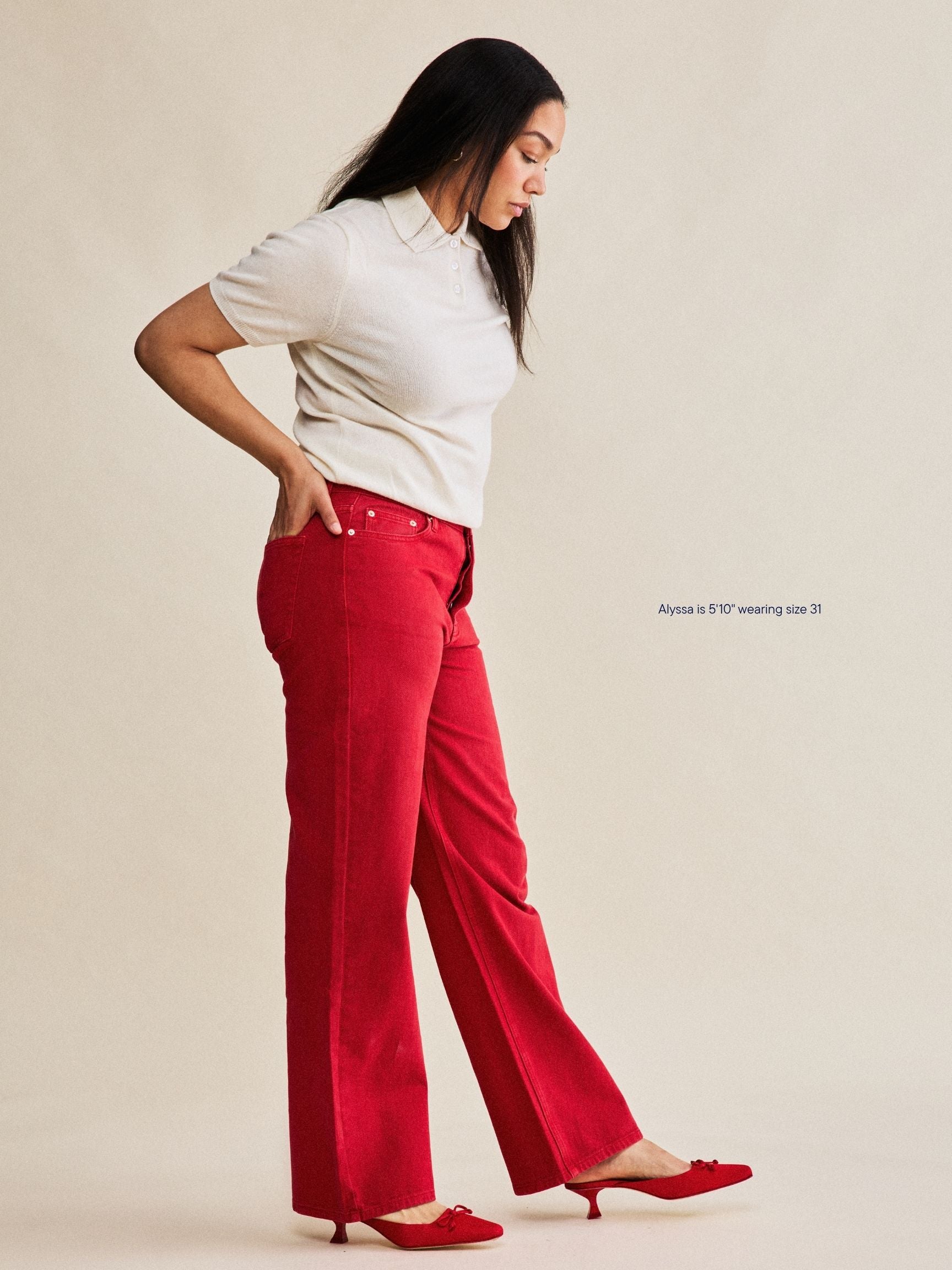 girl wearing classic straight jeans -washed red
