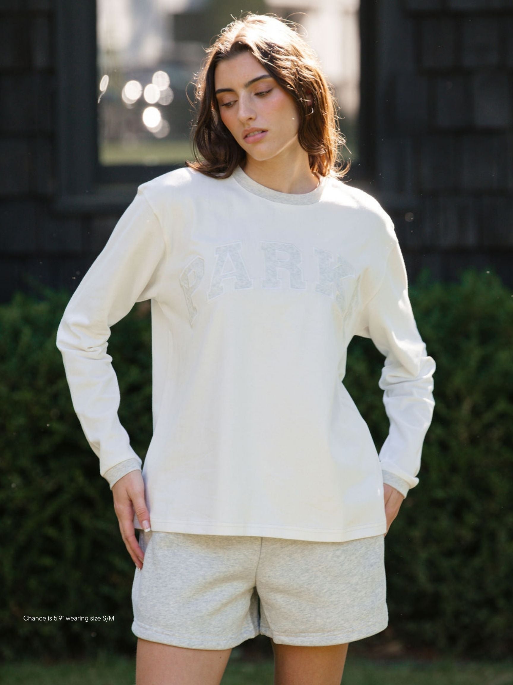 girl wearing varsity long sleeve -classic grey