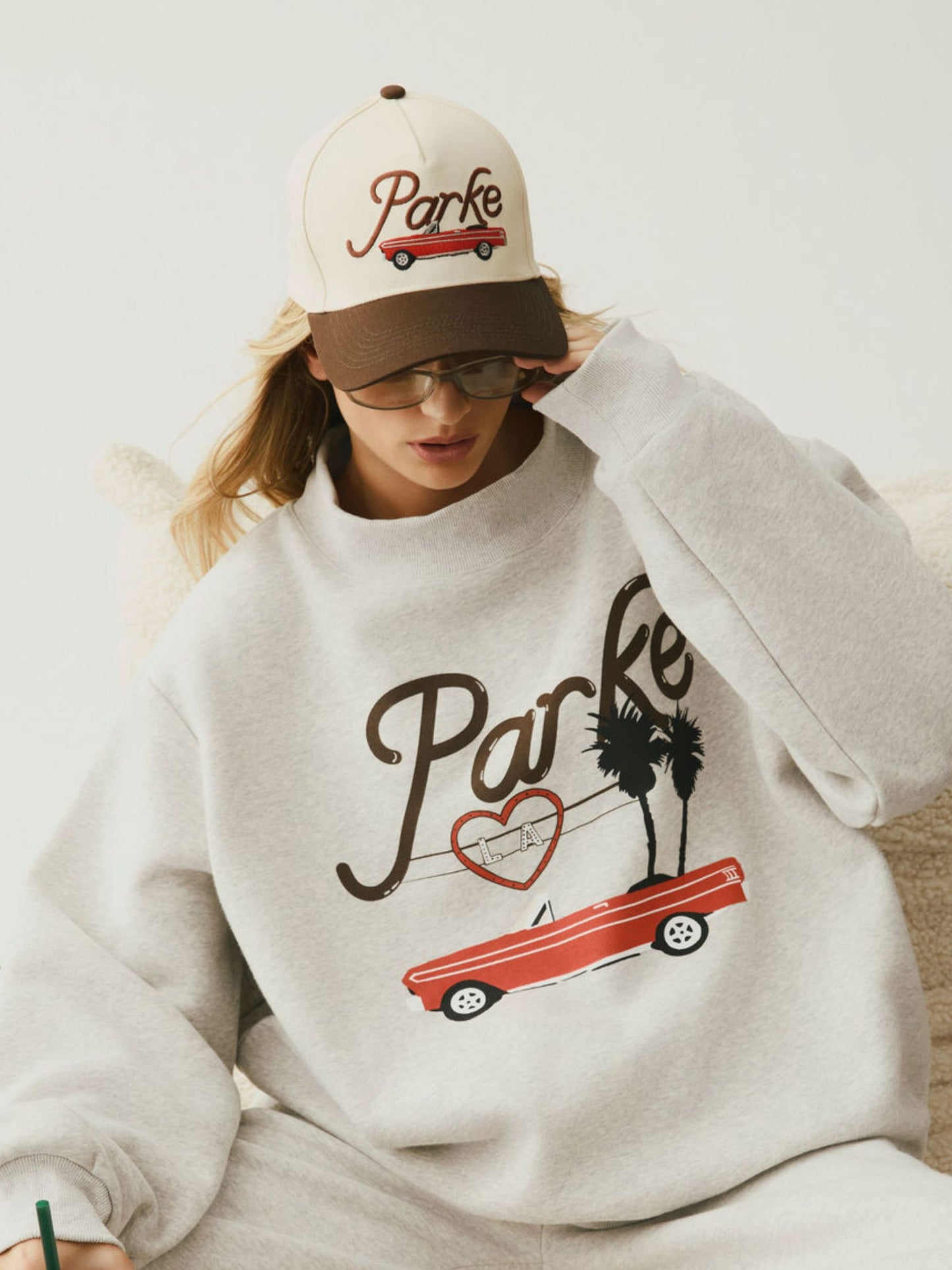 girl wearing Cities Hat Los Angeles -brown