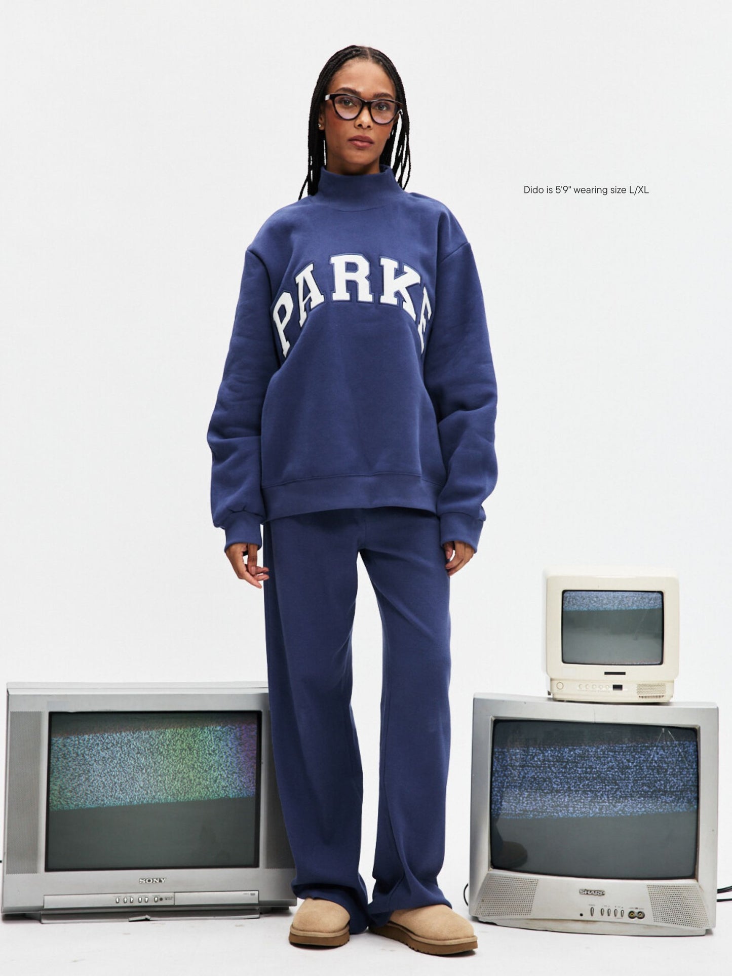 girl wearing Varsity Turtleneck -crown + white