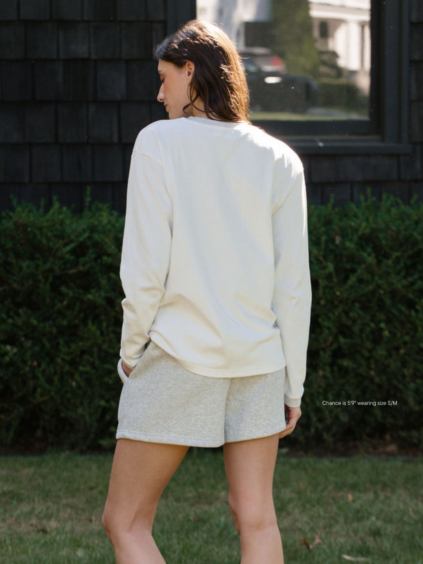 girl wearing varsity long sleeve -classic grey
