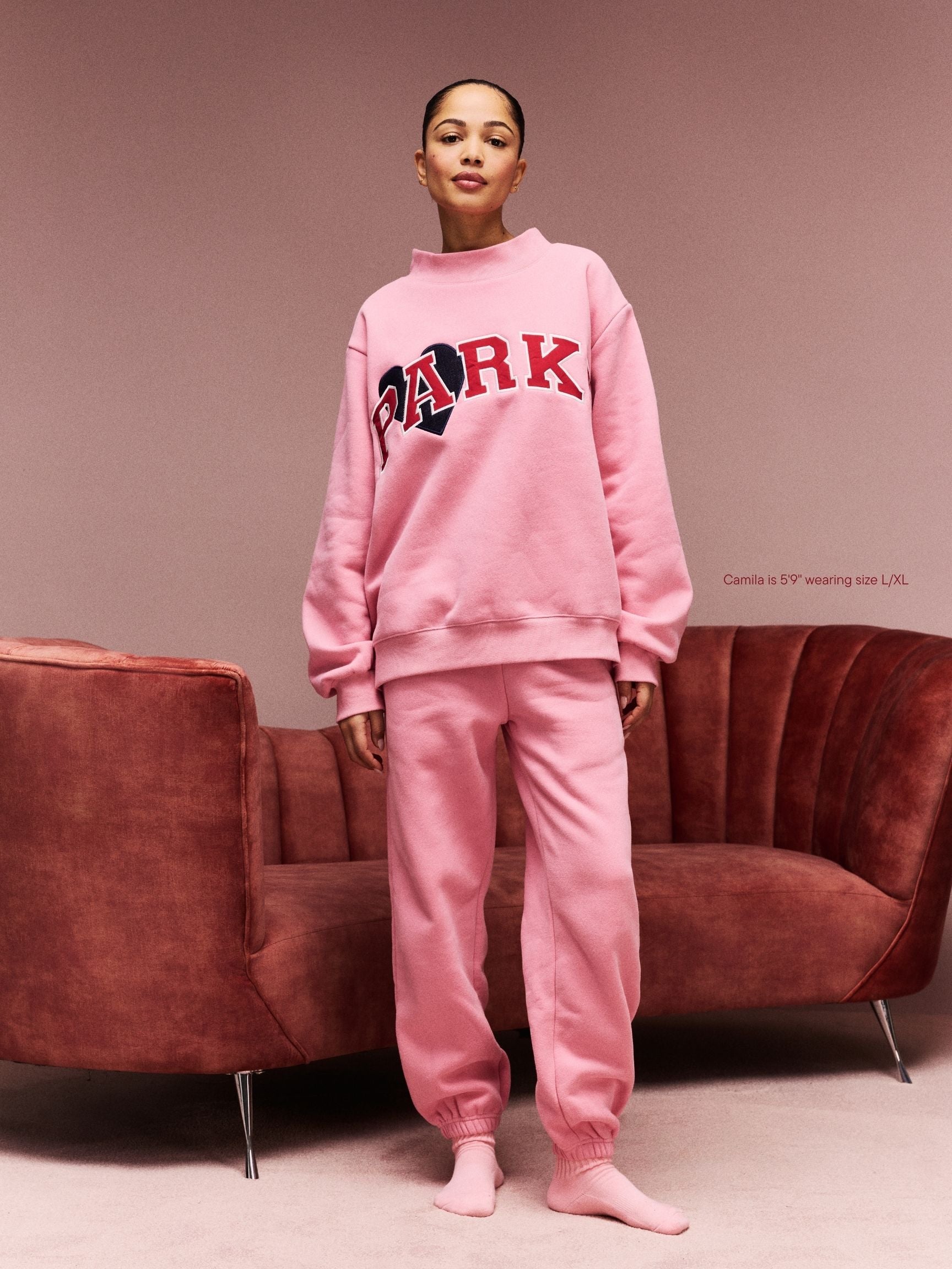 girl wearing Jean Heart Varsity Mockneck -blush