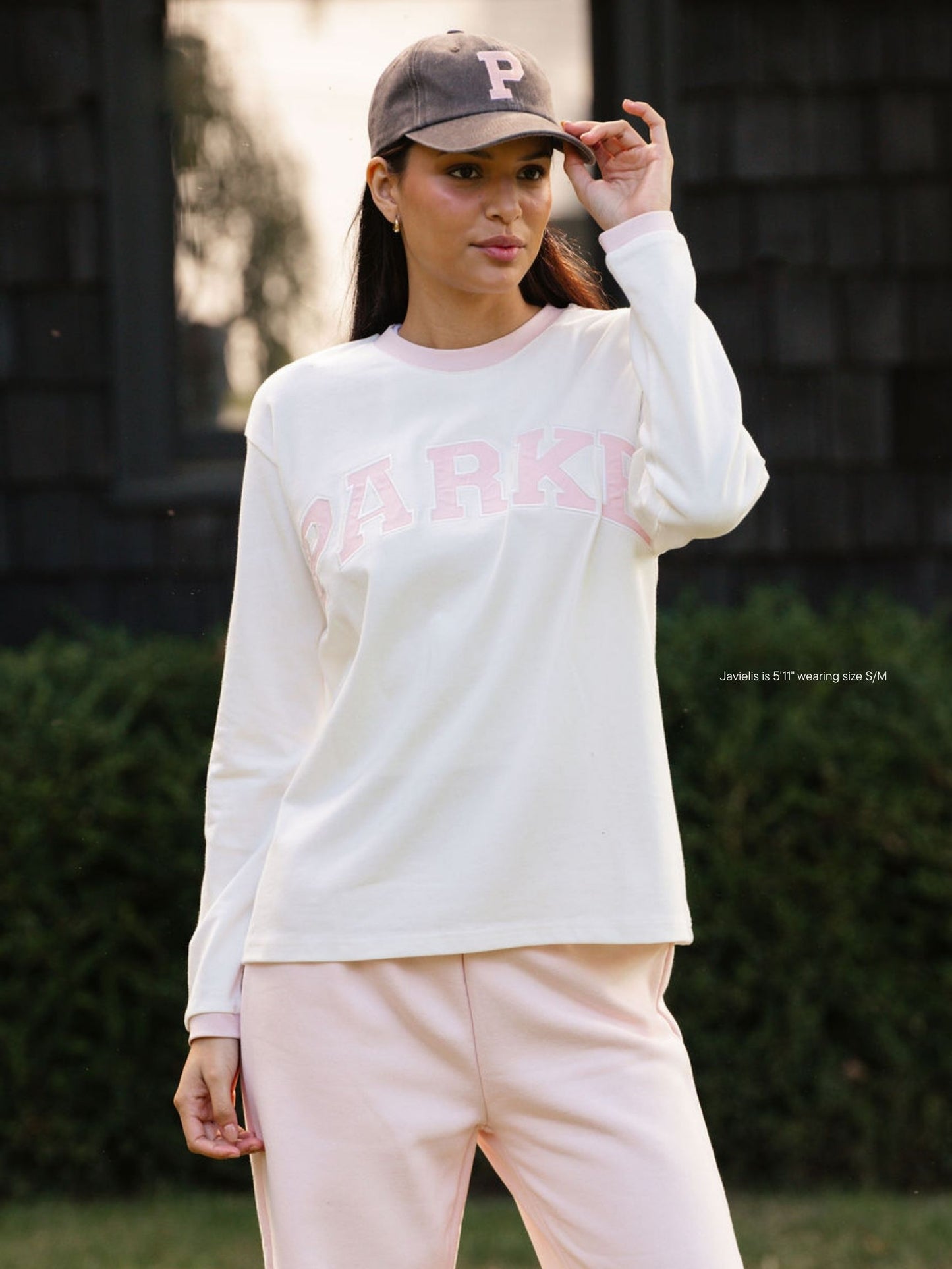 girl wearing varsity long sleeve-rose