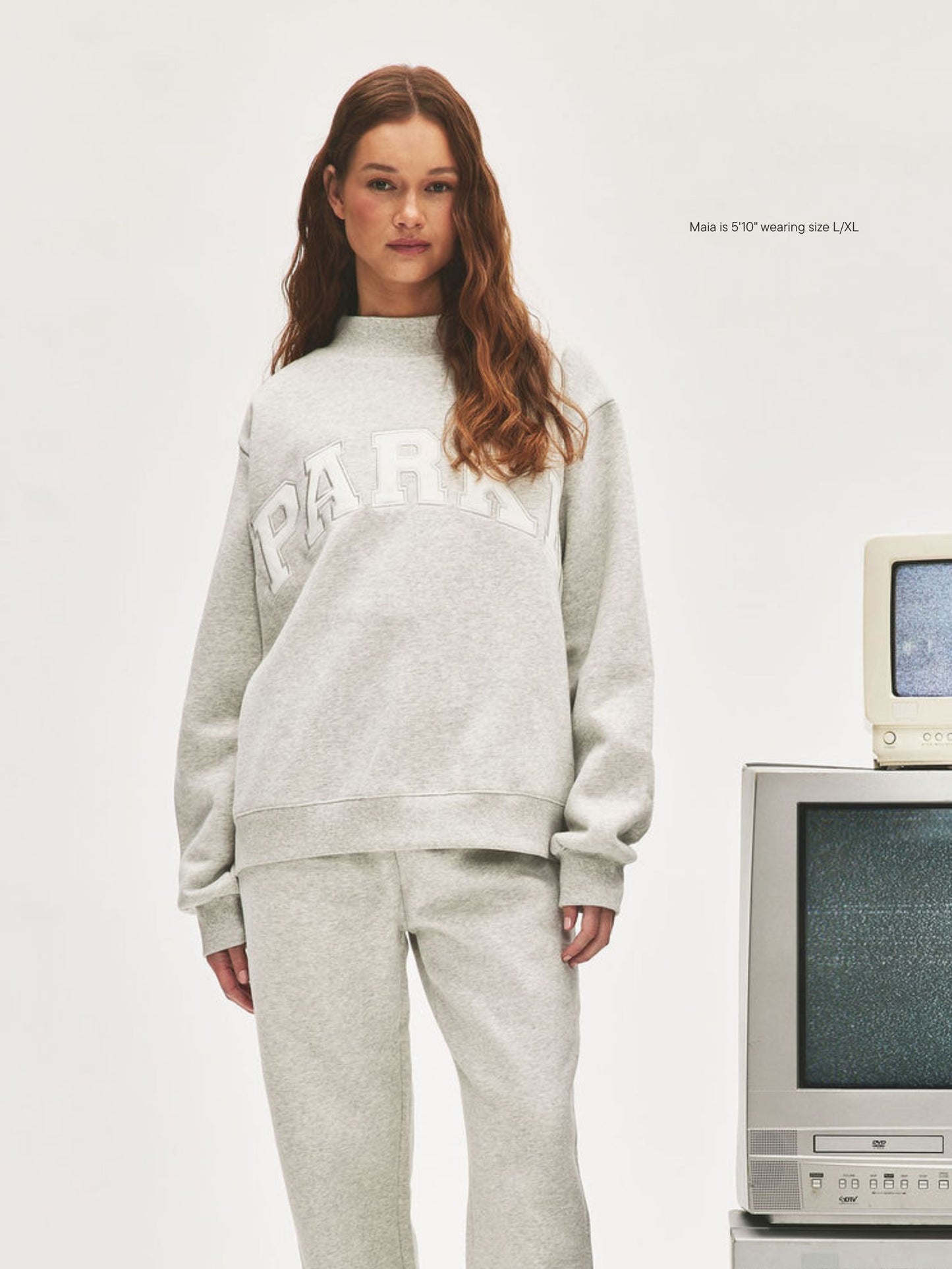girl wearing Nostalgia Varsity Mockneck -classic grey + white 