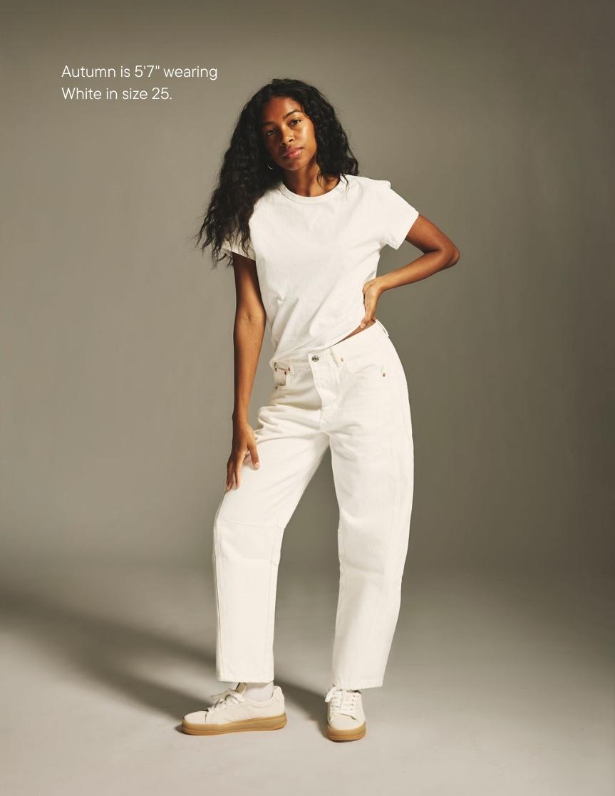 girl wearing horseshoe jean -white