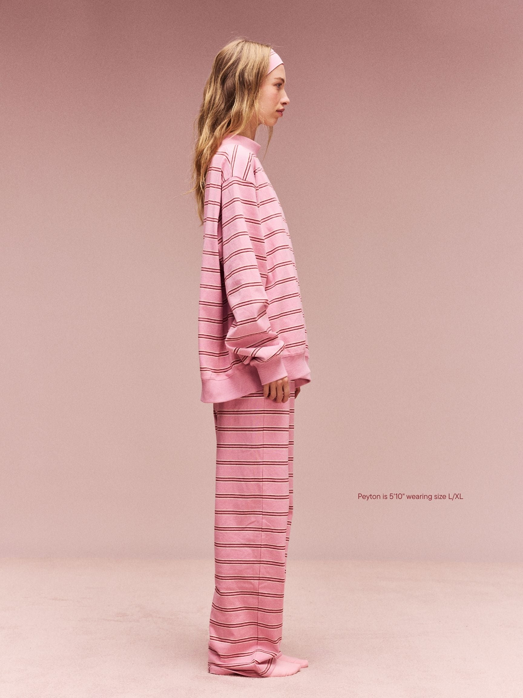 girl wearing Striped Mockneck Pullover -sweetheart stripe