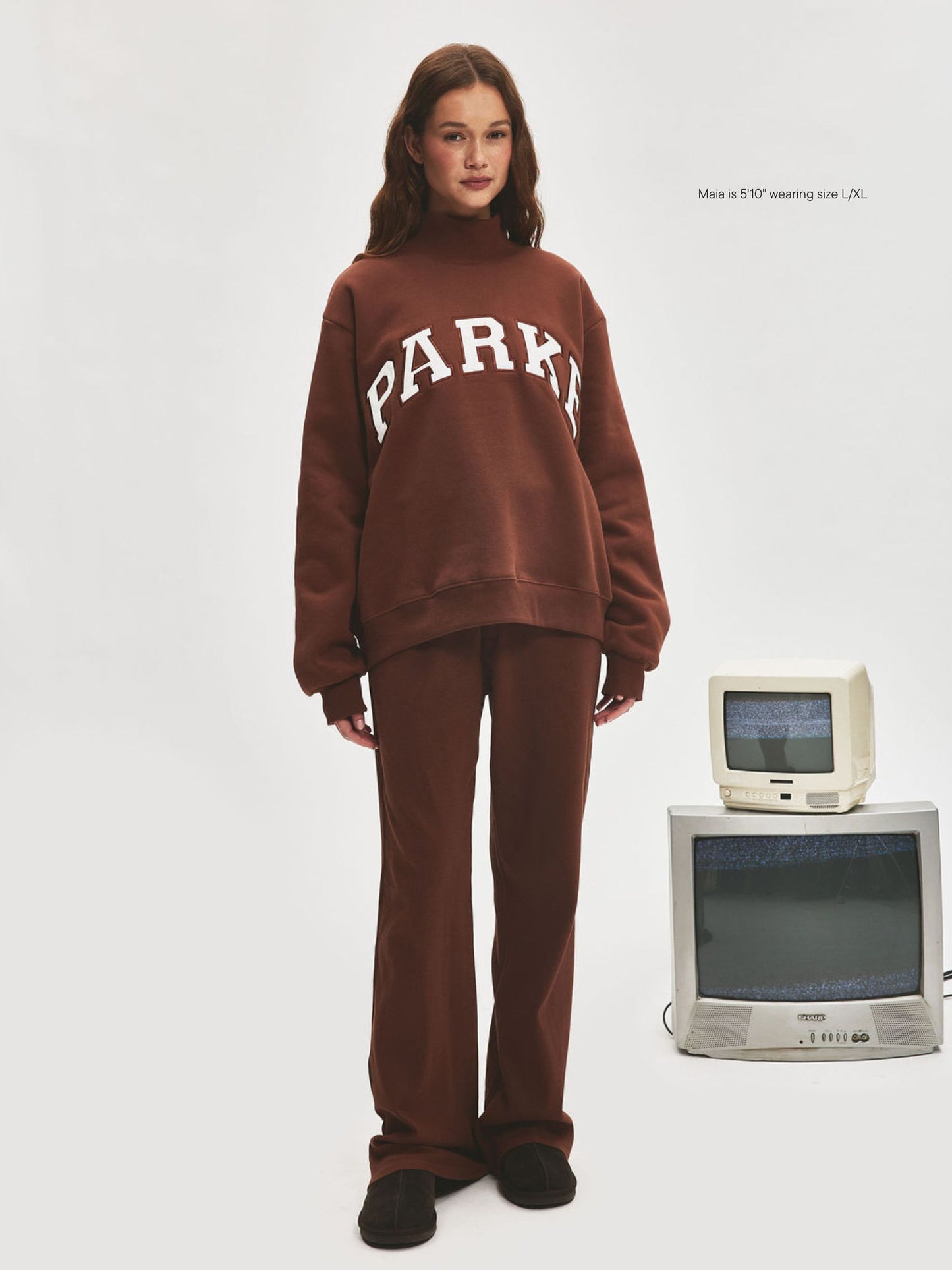 girl wearing Varsity Turtleneck -mocha + white