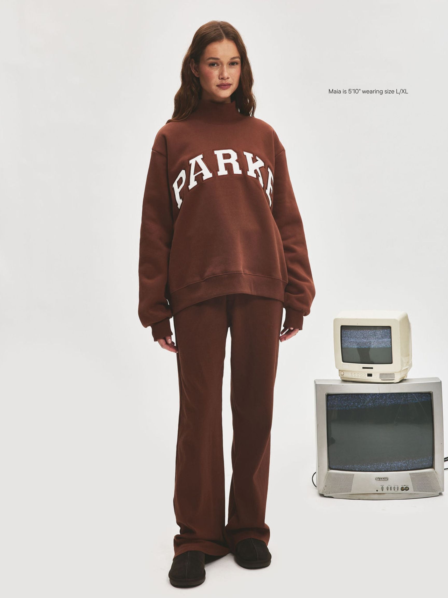 girl wearing Varsity Turtleneck -mocha + white