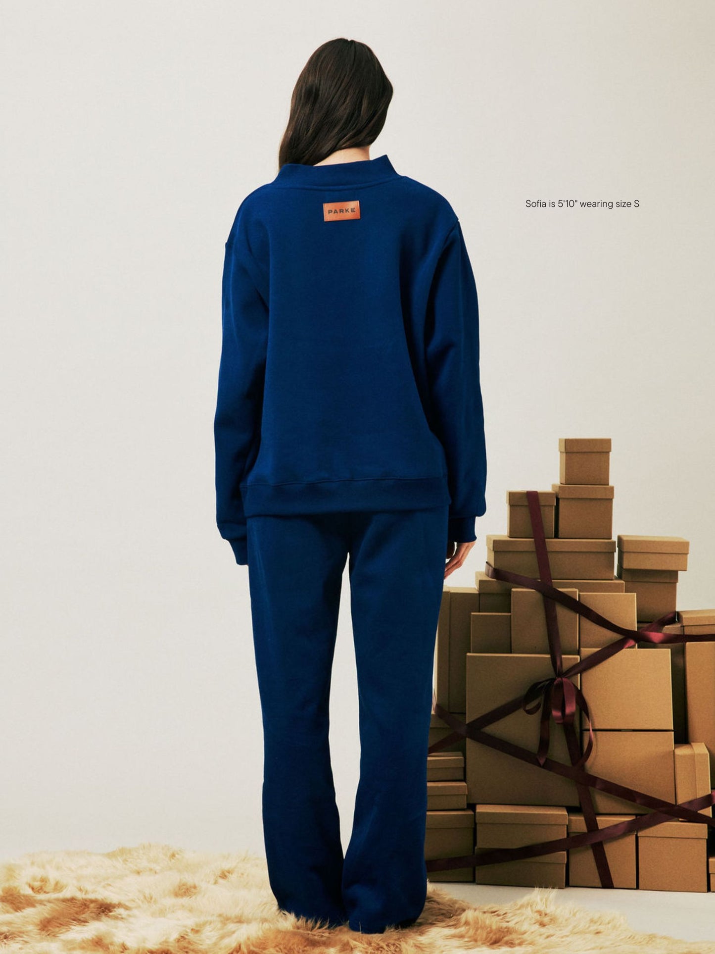 girl wearing Holiday Boxer Sweatpants -winter berry