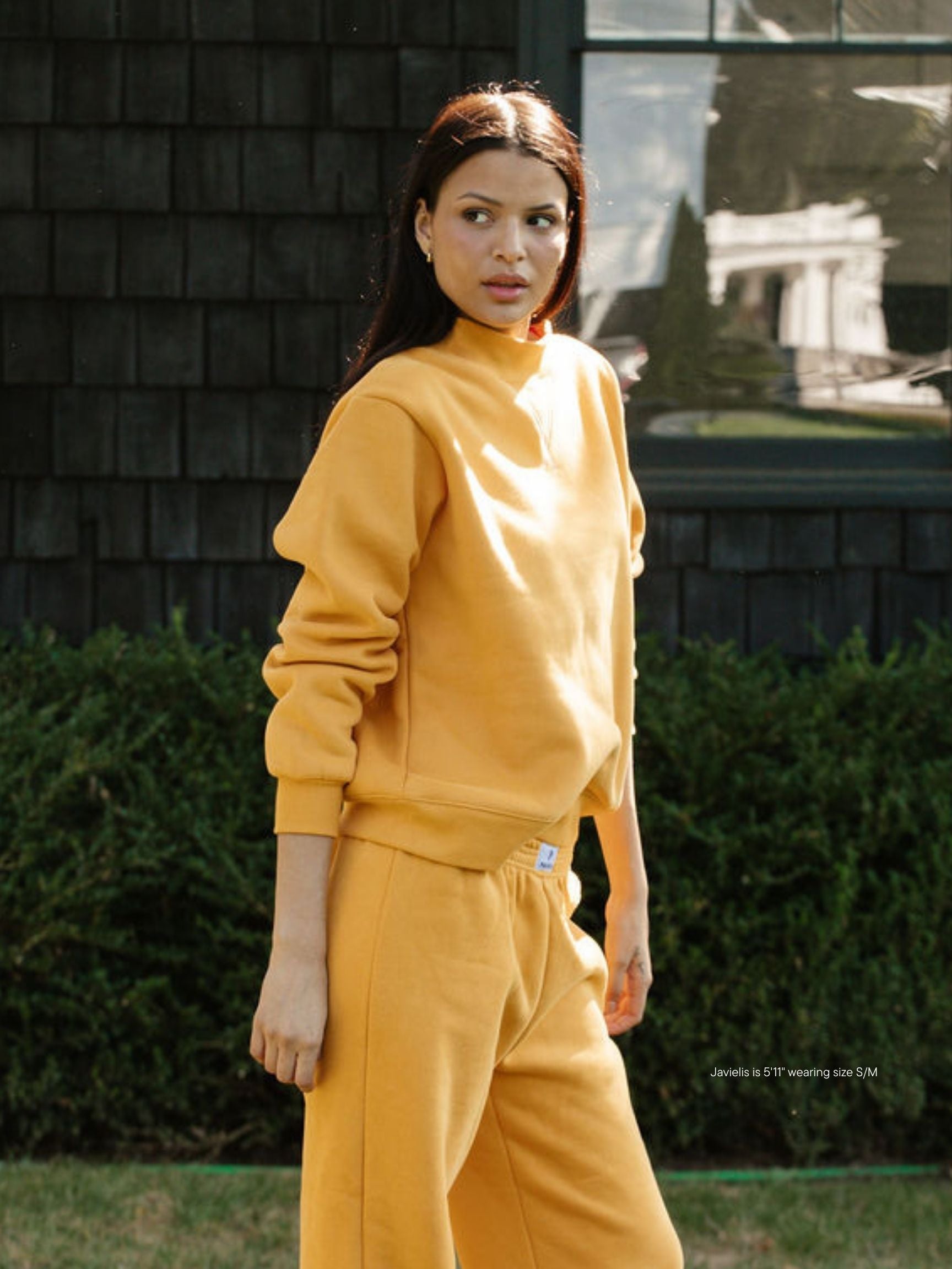 girl wearing charcoal classic mockneck -apricot