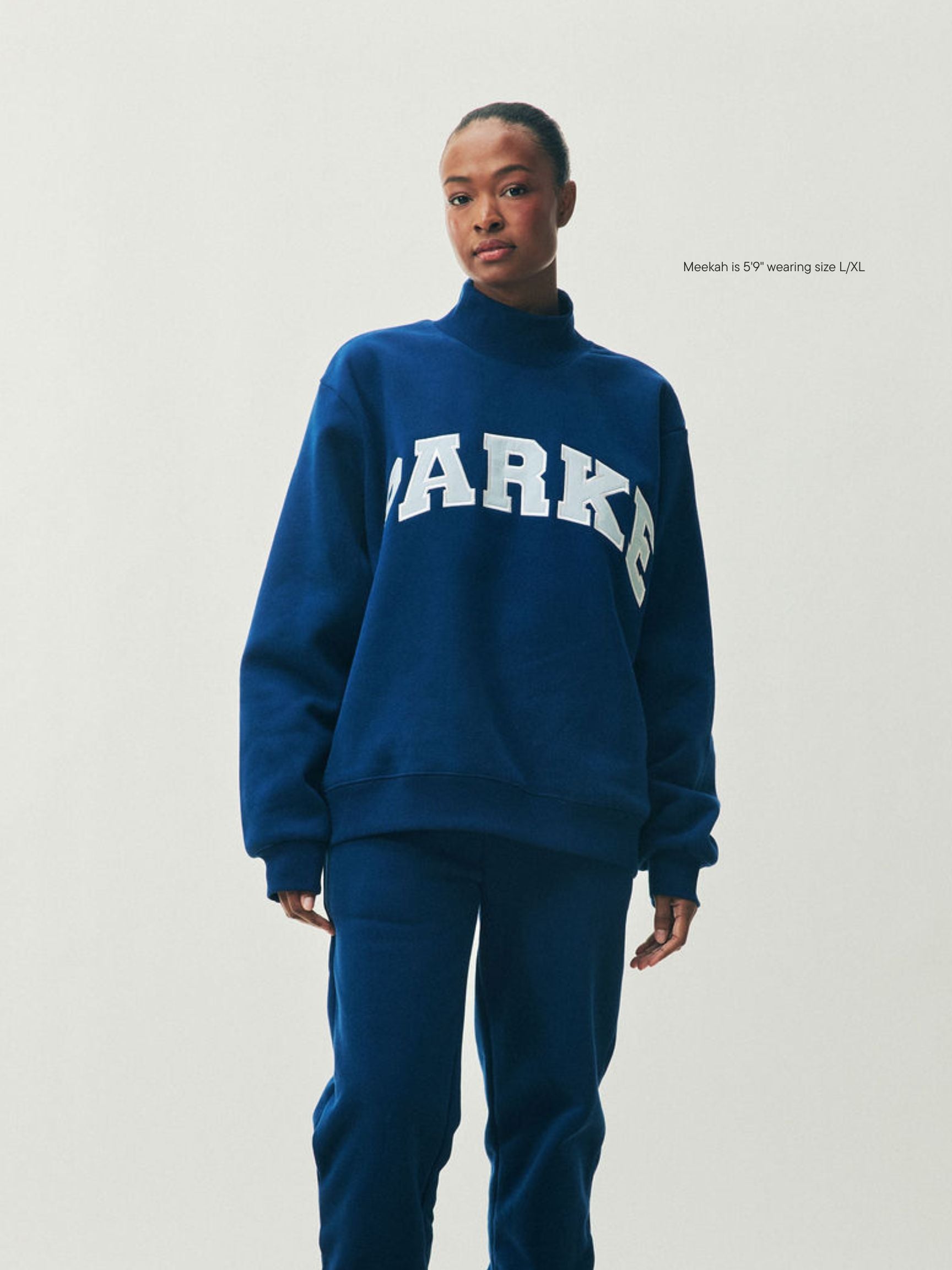 girl wearing Holiday Varsity Turtleneck -winter berry + baby blue