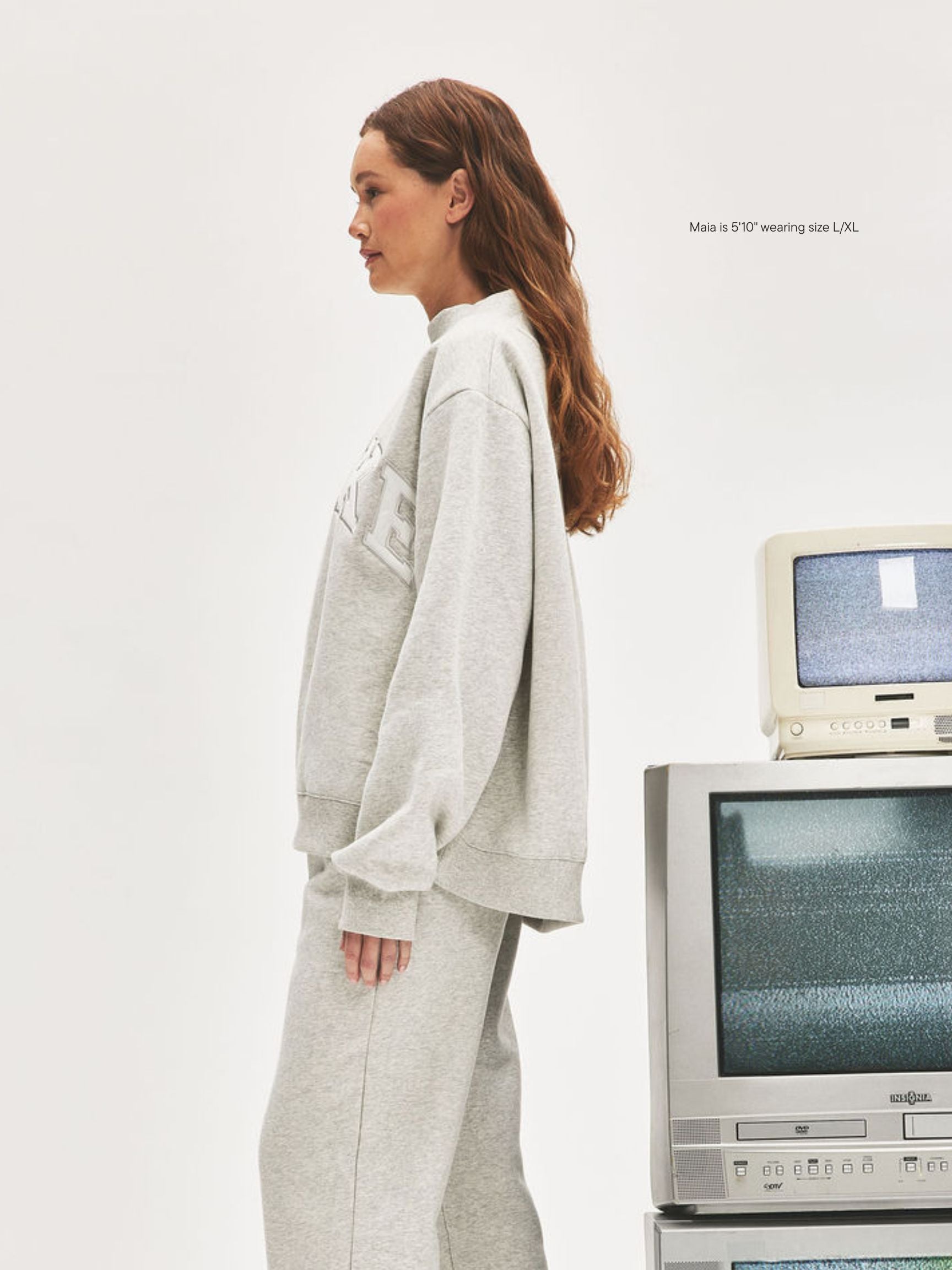 girl wearing Nostalgia Varsity Mockneck -classic grey + white 