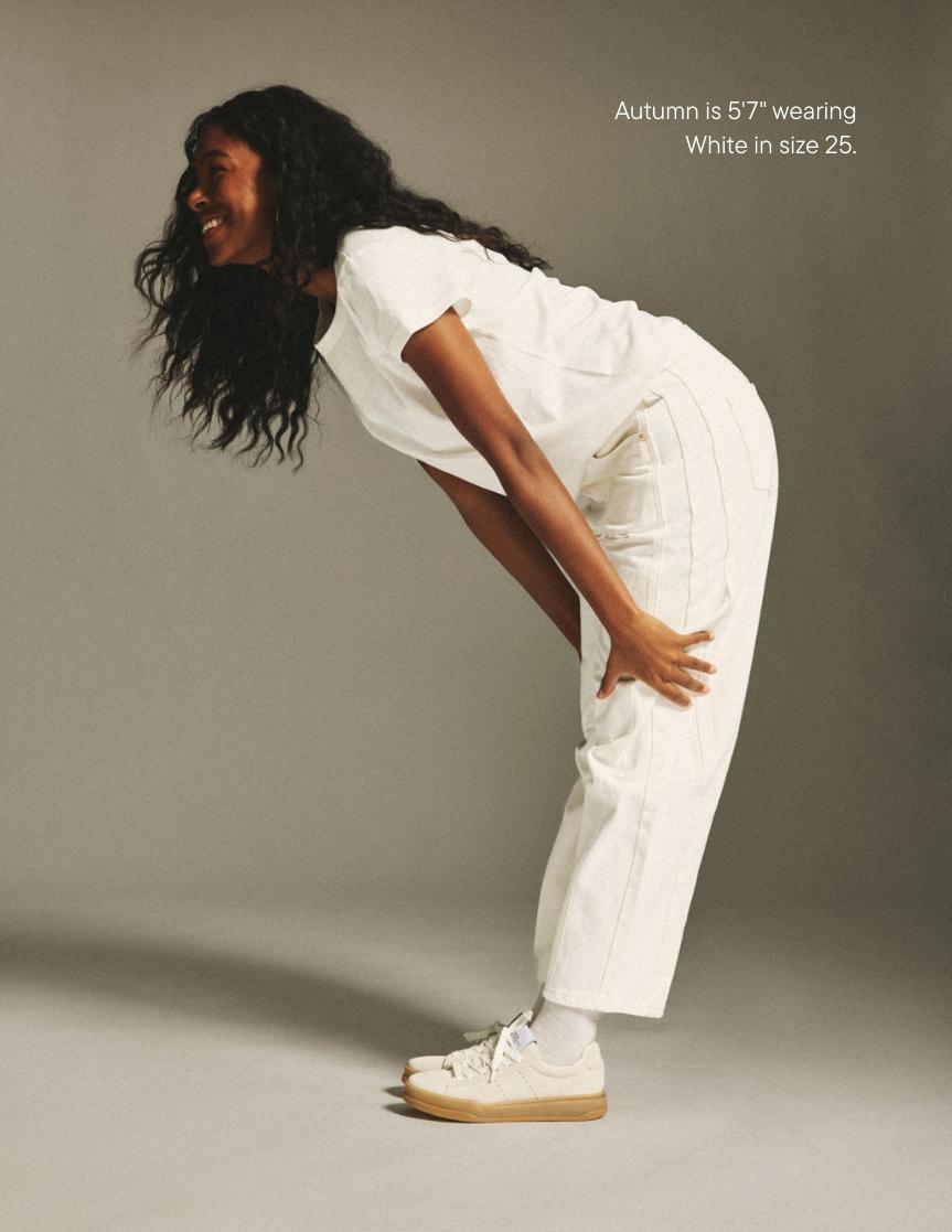 girl wearing horseshoe jean -white
