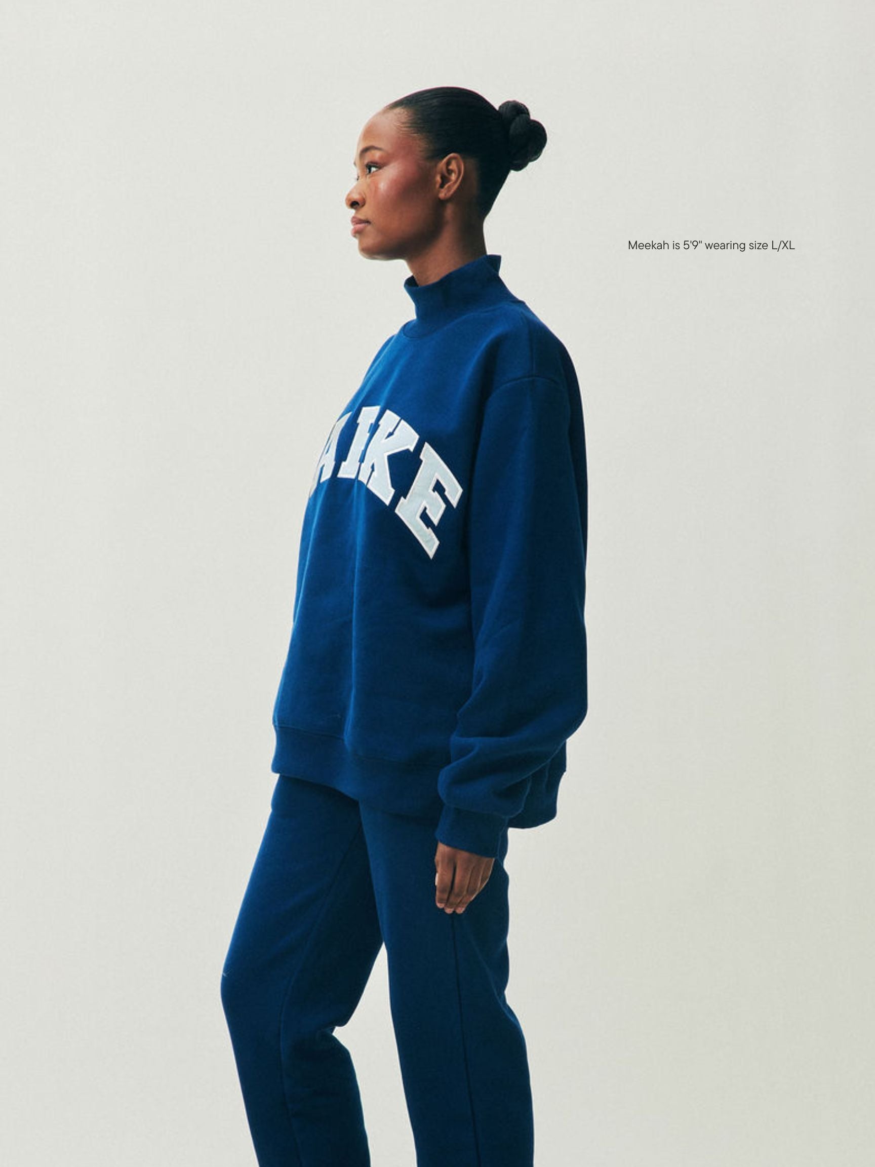 girl wearing Holiday Varsity Turtleneck -winter berry + baby blue