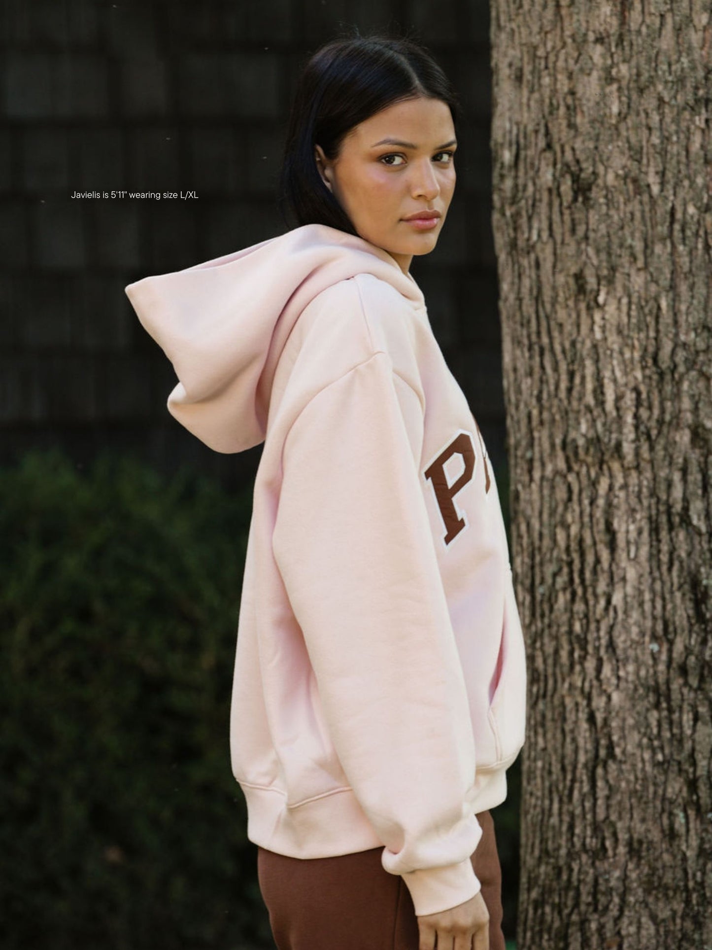 girl wearing varsity hoodie sweatshirt -rose + mocha