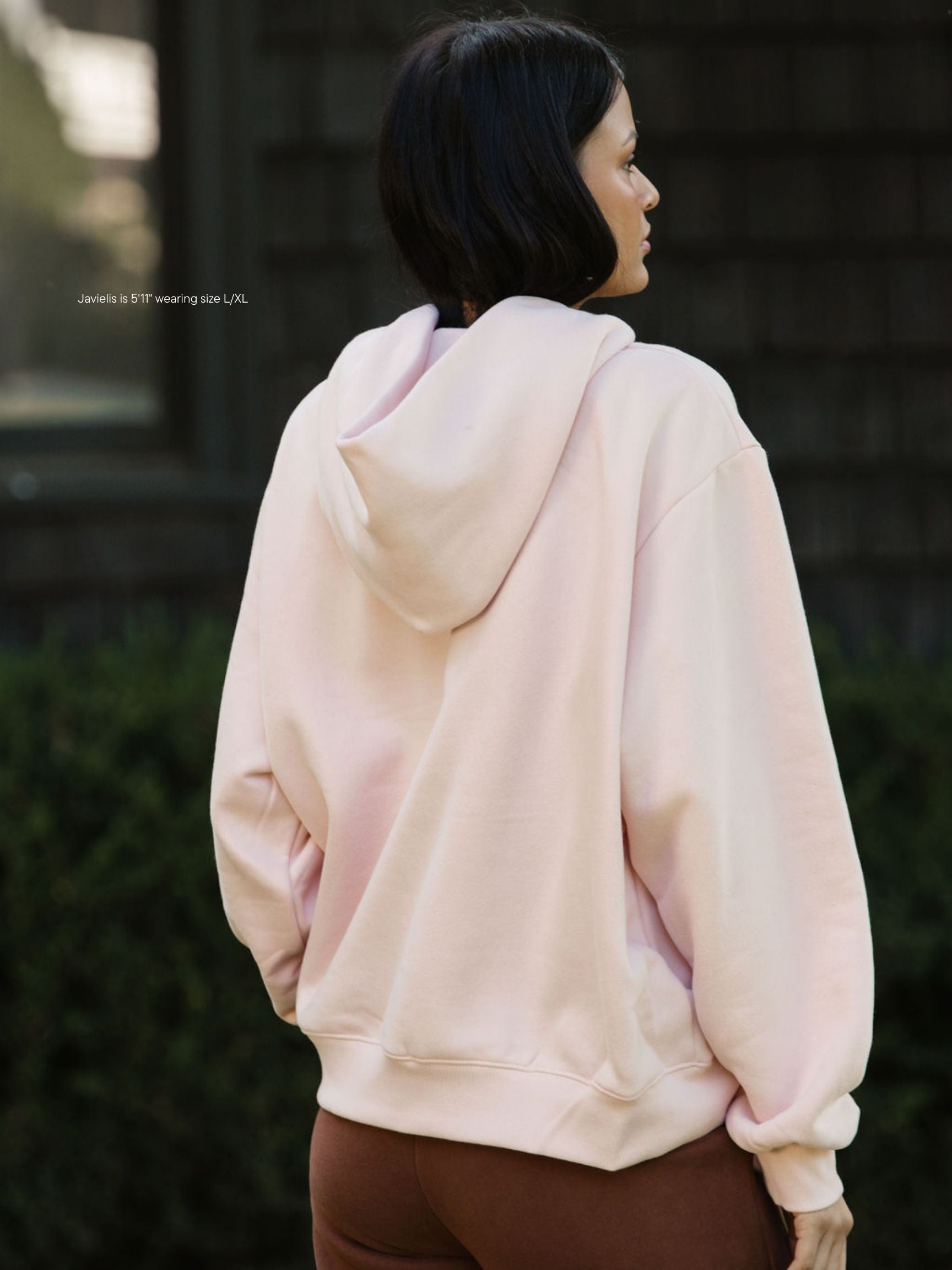 girl wearing varsity hoodie sweatshirt -rose + mocha