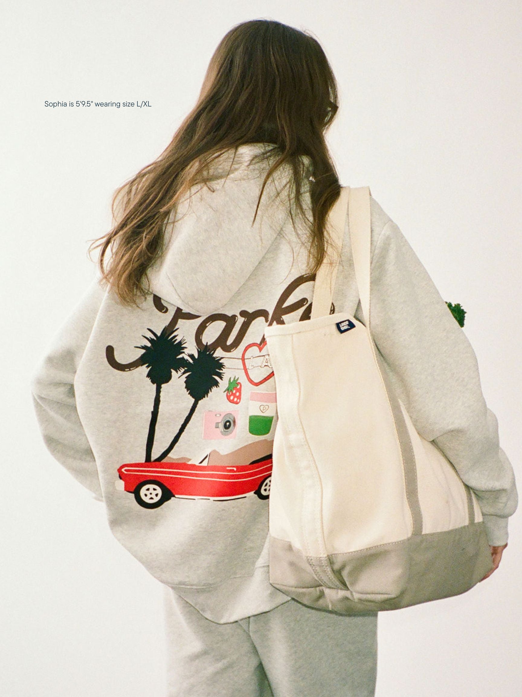 girl wearing Cities Graphic Hoodie -los angeles