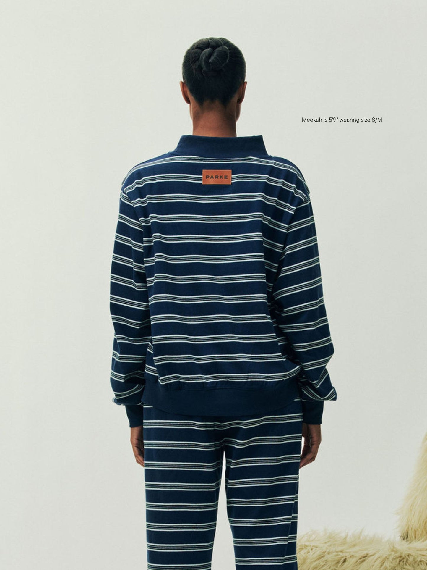 girl wearing Holiday Striped Pullover -snowflake stripe